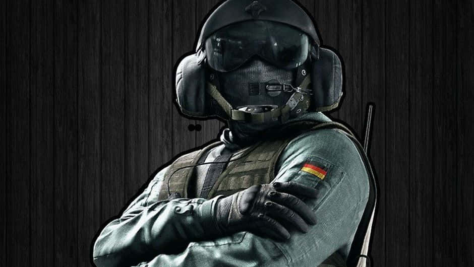 Rainbow Six Siege Jager 桌布 壁紙 — 一名全副武裝的戰術士兵自信地交叉雙臂，靠著深色木牆站立。