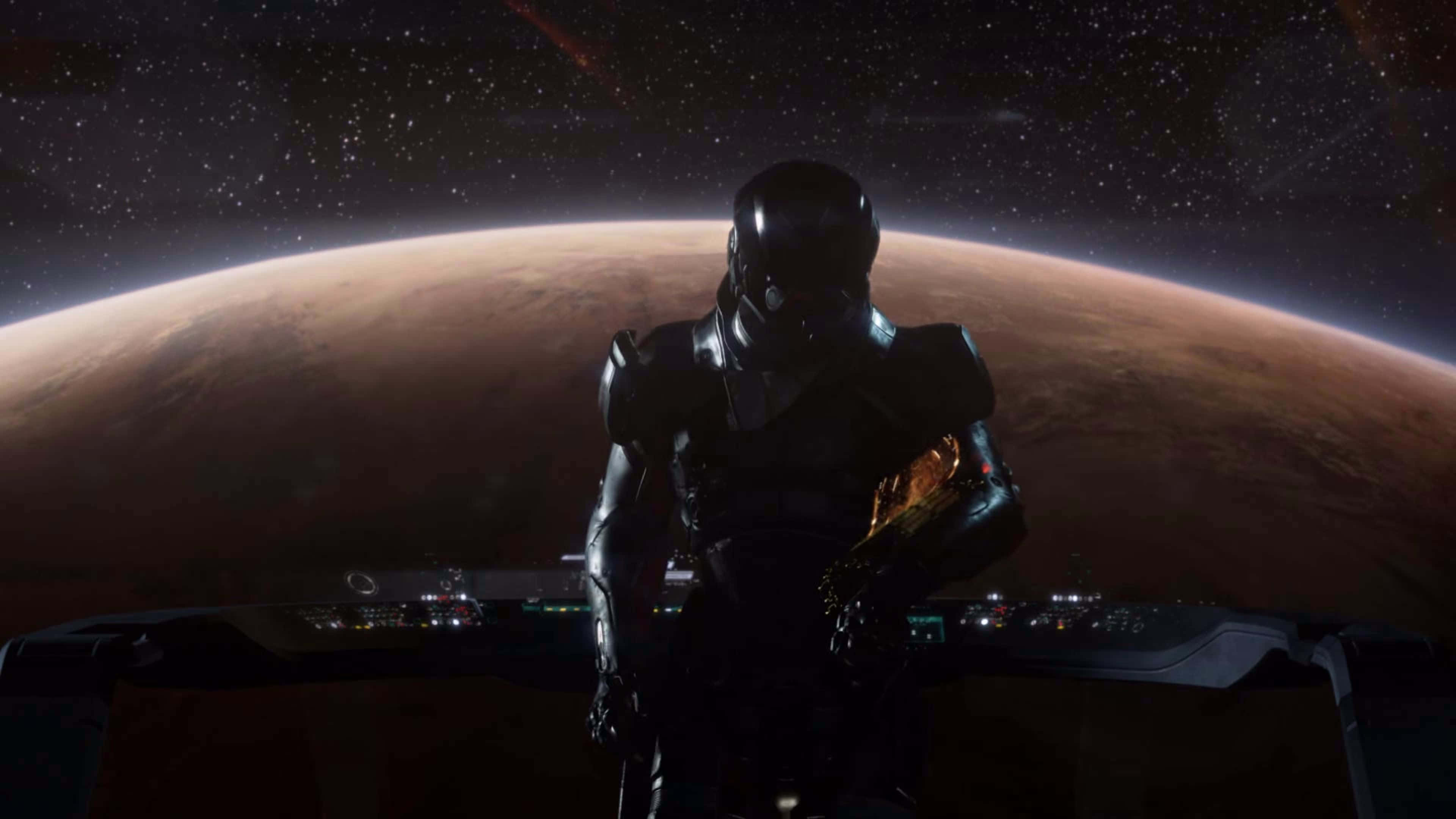Mass Effect Andromeda 桌布 壁紙 — 一名孤獨的太空人身穿時尚黑色太空衣，站在太空船駕駛艙內，凝視著星空宇宙背景下廣闊的微紅色行星。