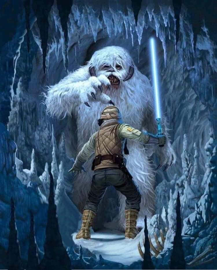 Wampa 桌布 壁紙 — 一名孤獨的戰士手持藍色光劍，在一個佈滿冰柱和積雪的冰凍洞穴中面對一隻巨大的白色武技獸。