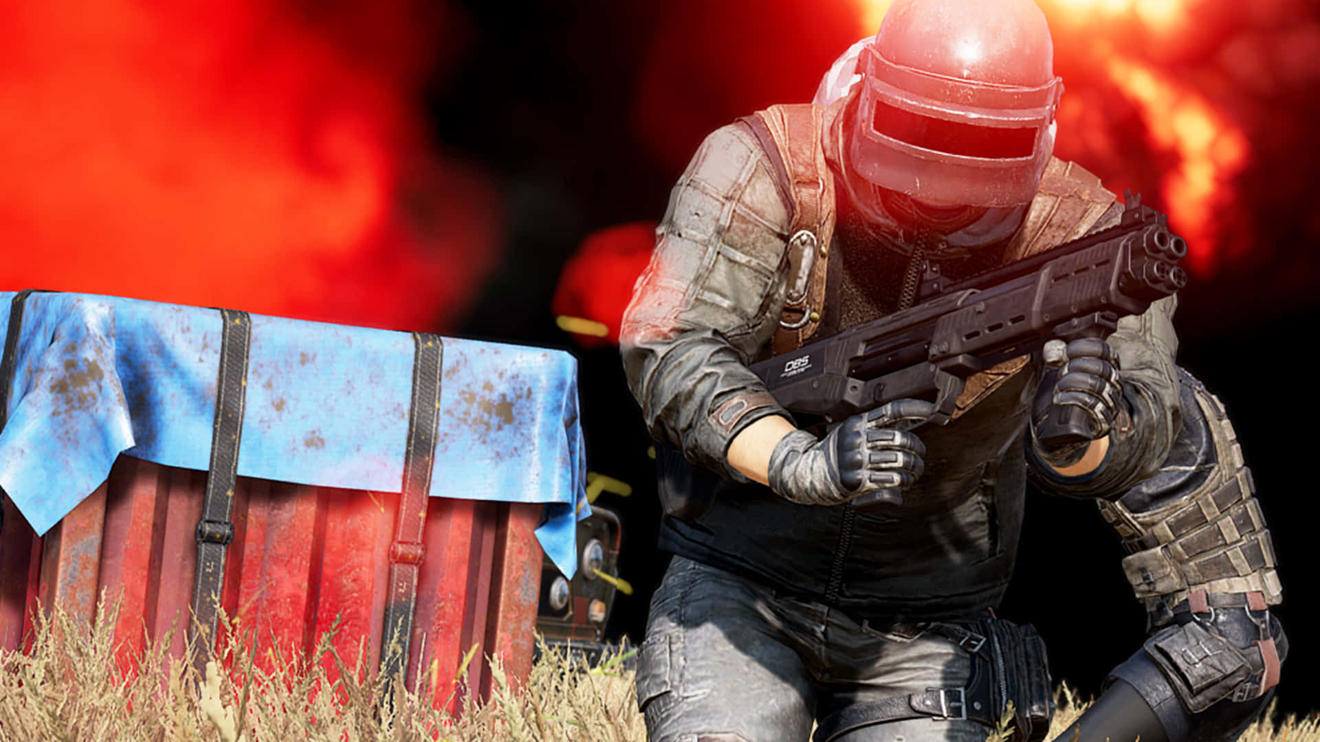 PUBG 桌布 壁紙 — 一名戴著紅色頭盔、身穿戰術裝備的士兵蹲在一個生鏽的木箱後面，身後正發生猛烈爆炸。