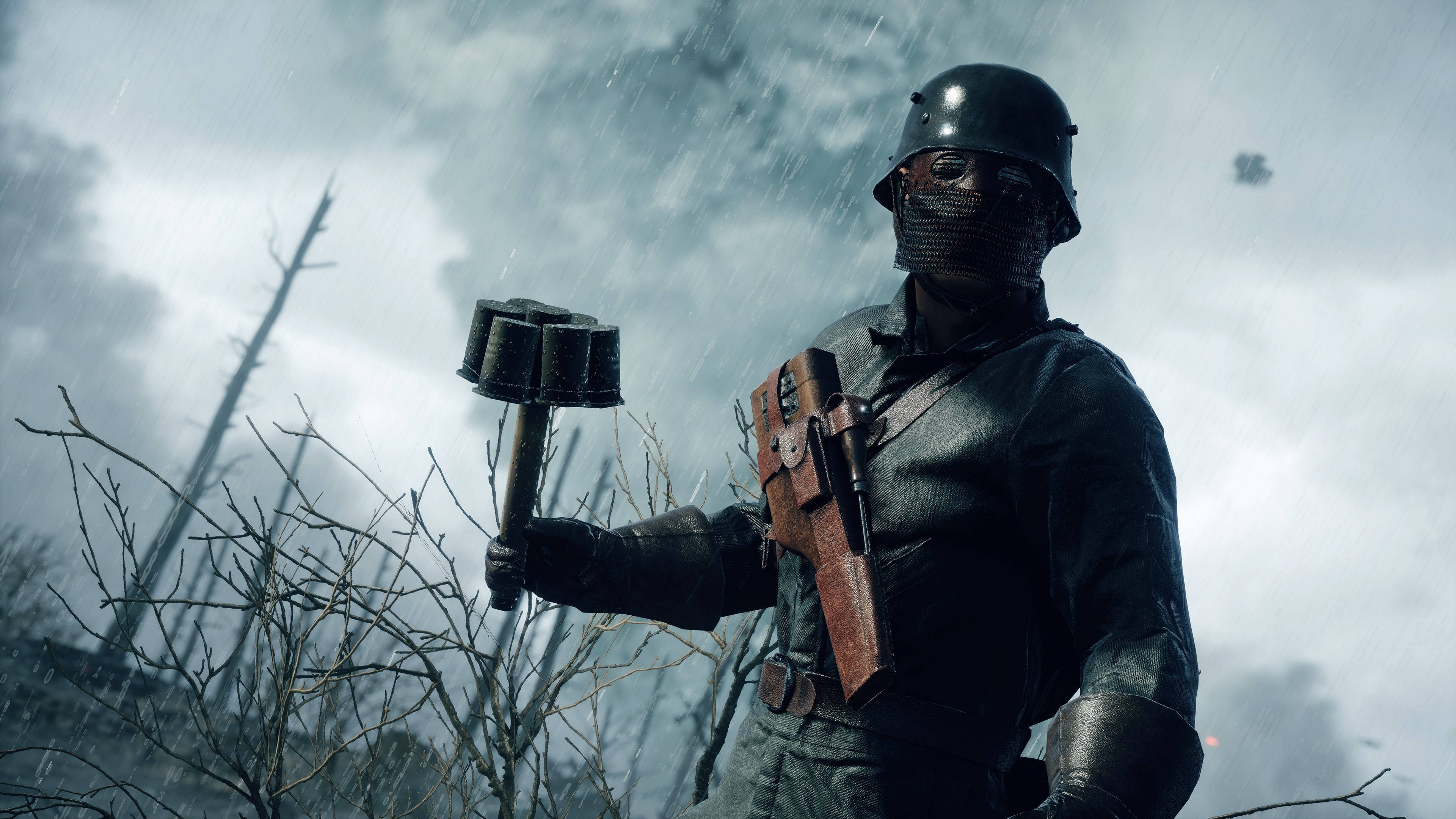Battlefield 1 HD 桌布 壁紙 — 一名戴著頭盔和面具的士兵在風暴天空下、雨淋的荒涼戰場上握著手榴彈。