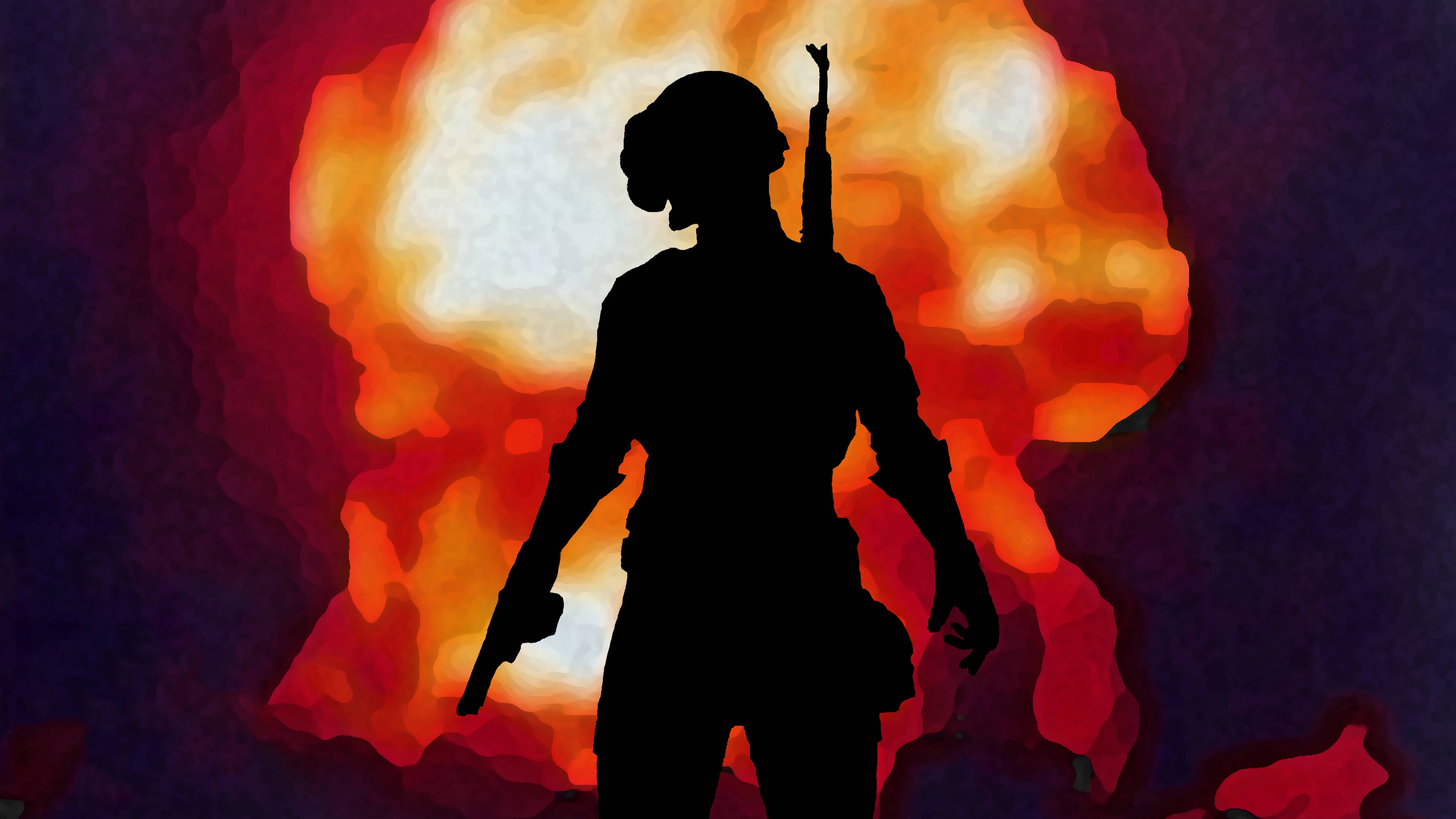 Silhouette 桌布 壁紙 — 一名持槍士兵的剪影站在熾熱爆炸前，帶有鮮豔的橙色和紅色色調。