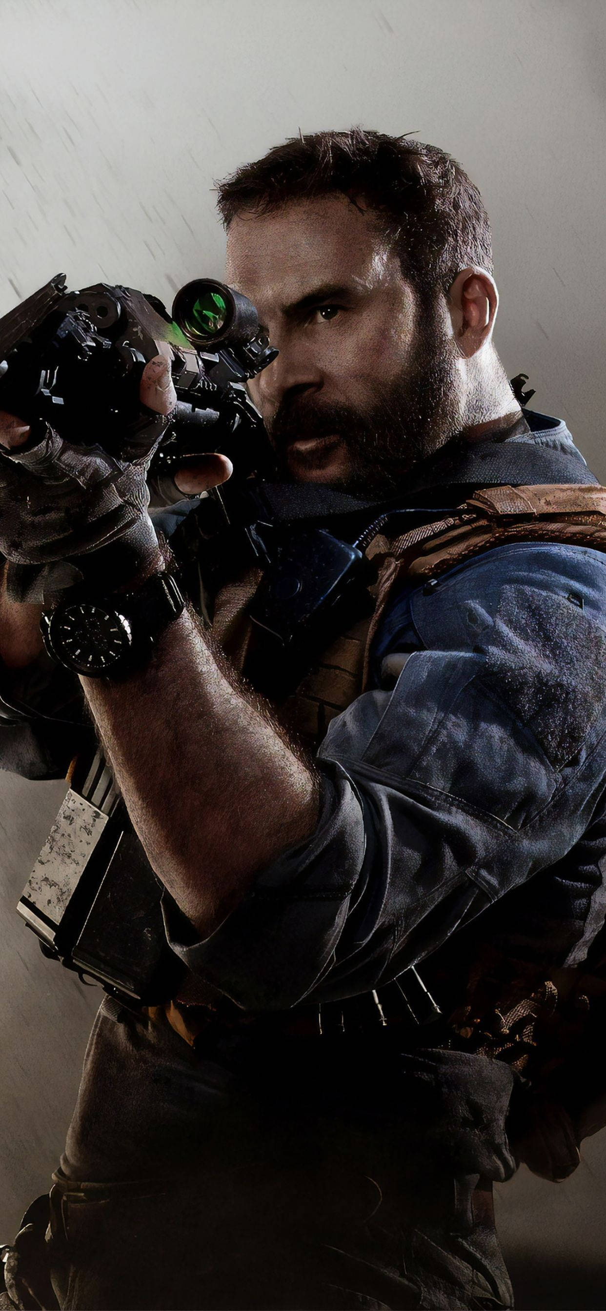 Call Of Duty Modern Warfare iPhone 桌布 壁紙 — 一名留鬍子的士兵身穿戰術裝備，在粗糙的室內環境中瞄準帶有發光瞄準鏡的步槍。