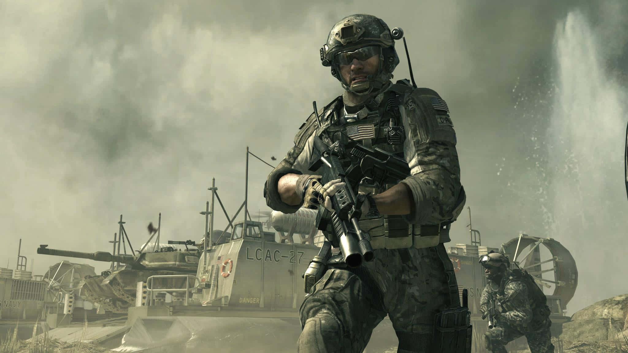 Call Of Duty Soldiers 桌布 壁紙 — 一名身穿全套戰鬥裝備的士兵在煙霧瀰漫的灰色天空下，於被戰爭摧毀的軍車之間持步槍警戒站立。