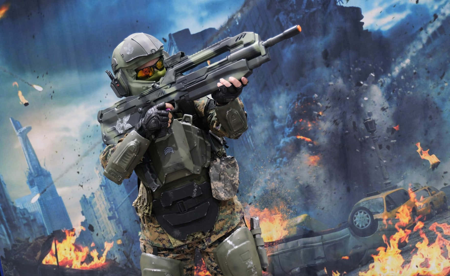 3d Gaming 桌布 壁紙 — 一名身穿全套戰鬥裝備的士兵在熾熱的爆炸和崩塌的未來城市廢墟中瞄準步槍。