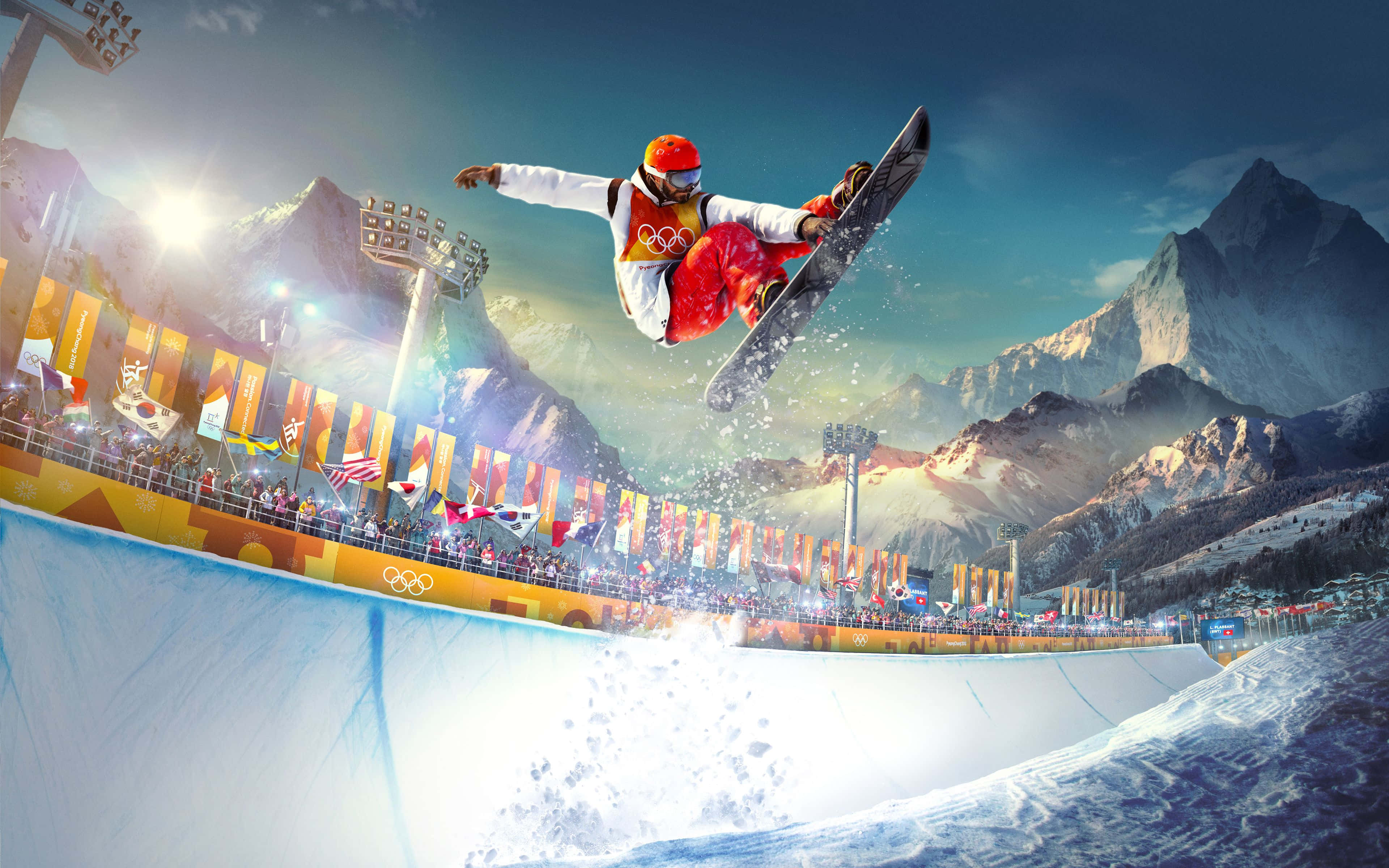 Winter Sports 桌布 壁紙 — 一名身穿紅白衣服的滑雪板運動員在雪山奧運場地的雪地半管上方飛翔，下方有旗幟和觀眾。