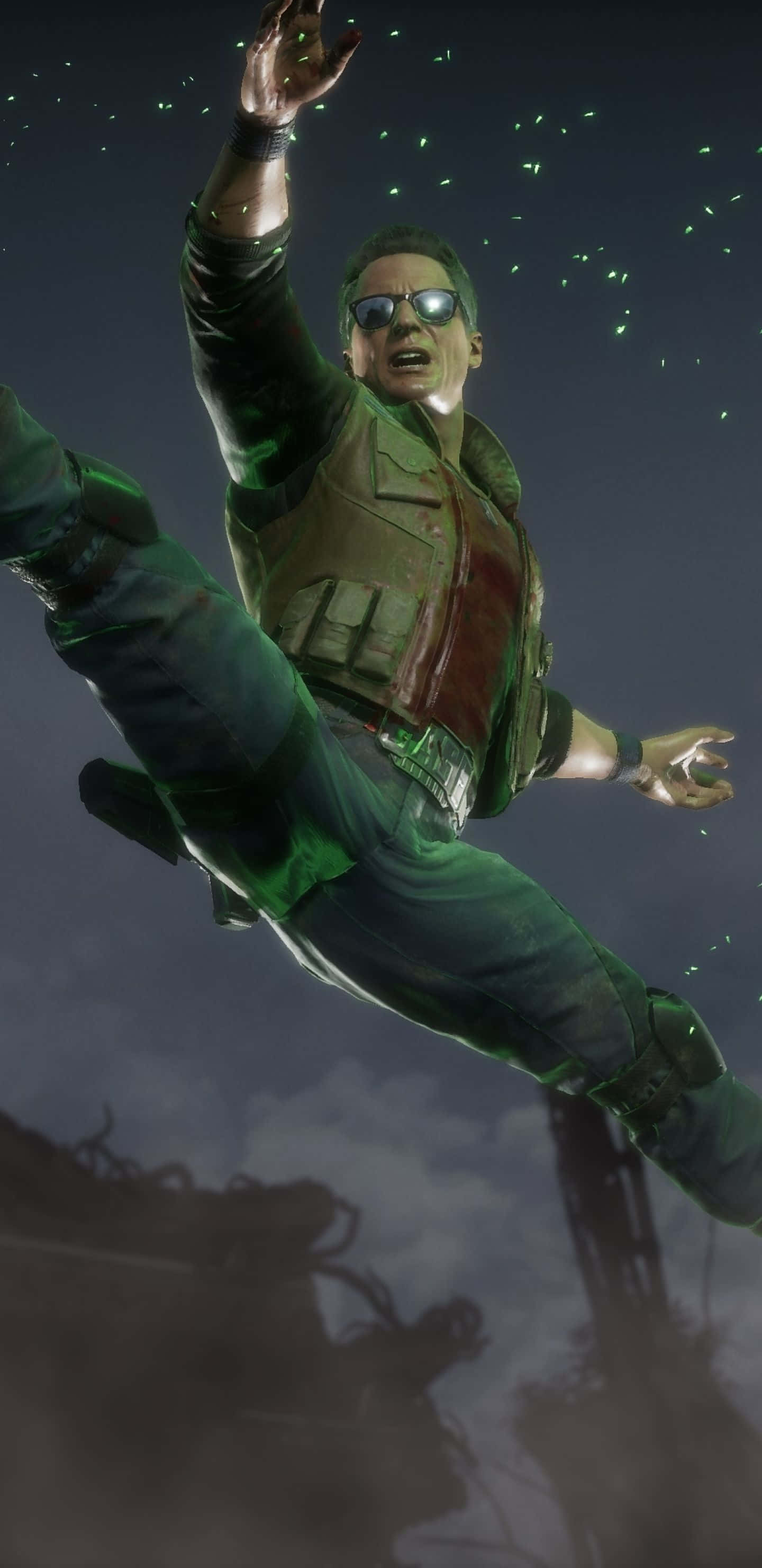 Johnny Cage 桌布 壁紙 — 一名身穿綠色戰術裝備和太陽眼鏡的男子在黑暗的天空中跳躍，周圍有發光的粒子旋轉。