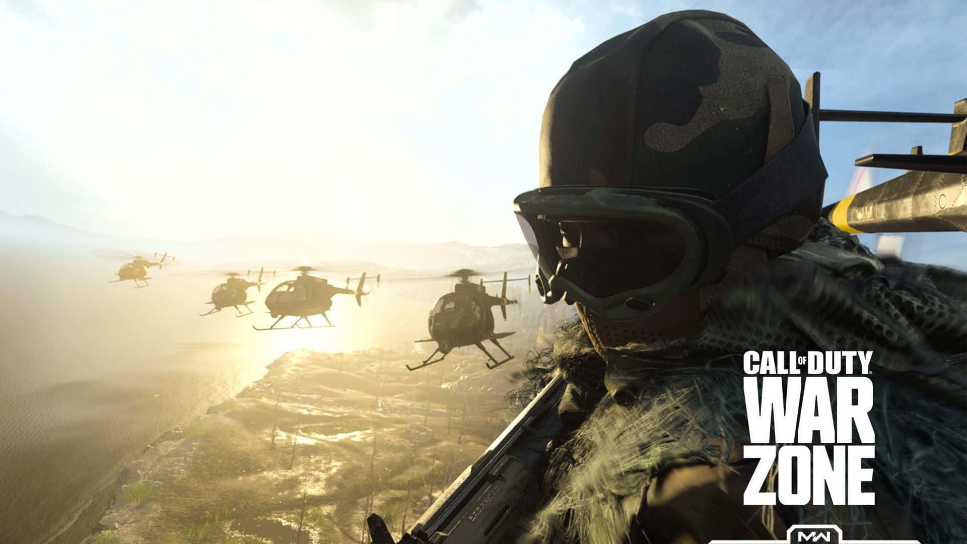 Call Of Duty Vehicles 桌布 壁紙 — 一名身穿迷彩裝備的士兵手持步槍，直升機在Call of Duty Warzone中陽光普照的海岸戰場上空飛過。