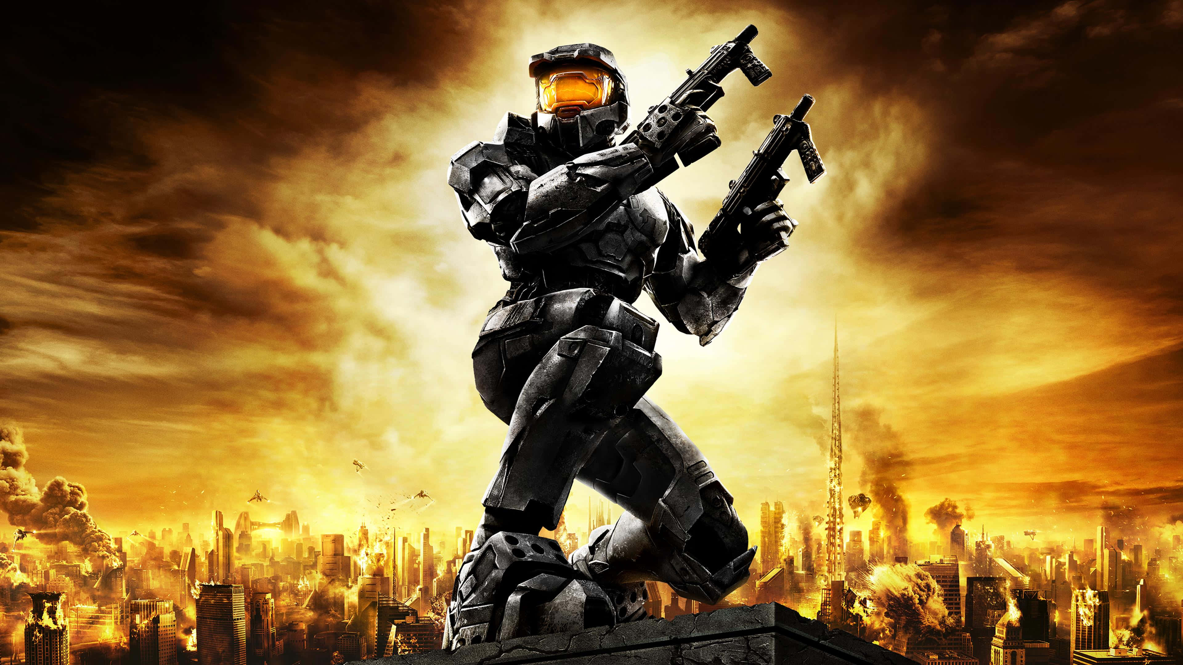 halo 桌布 壁紙 — 一名身穿重甲嘅斯巴達戰士企喺廢墟上，手持兩件武器，背景係燃燒嘅城市上空火橙色嘅天空。