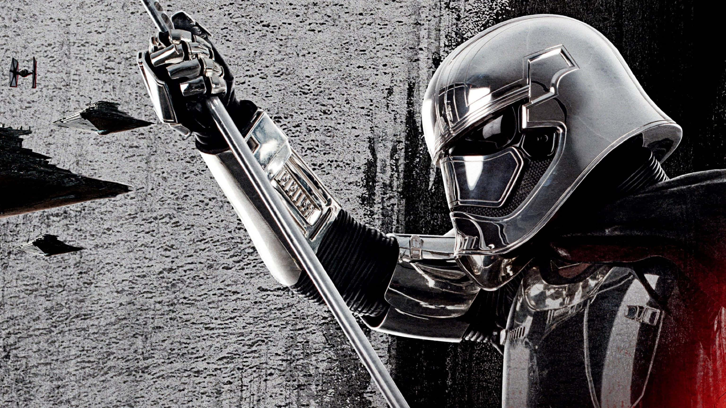 Captain Phasma 桌布 壁紙 — 一名身穿鉻合金裝甲的第一軍團軍官在星際戰機飛舞的荒涼戰場背景中高舉光劍。