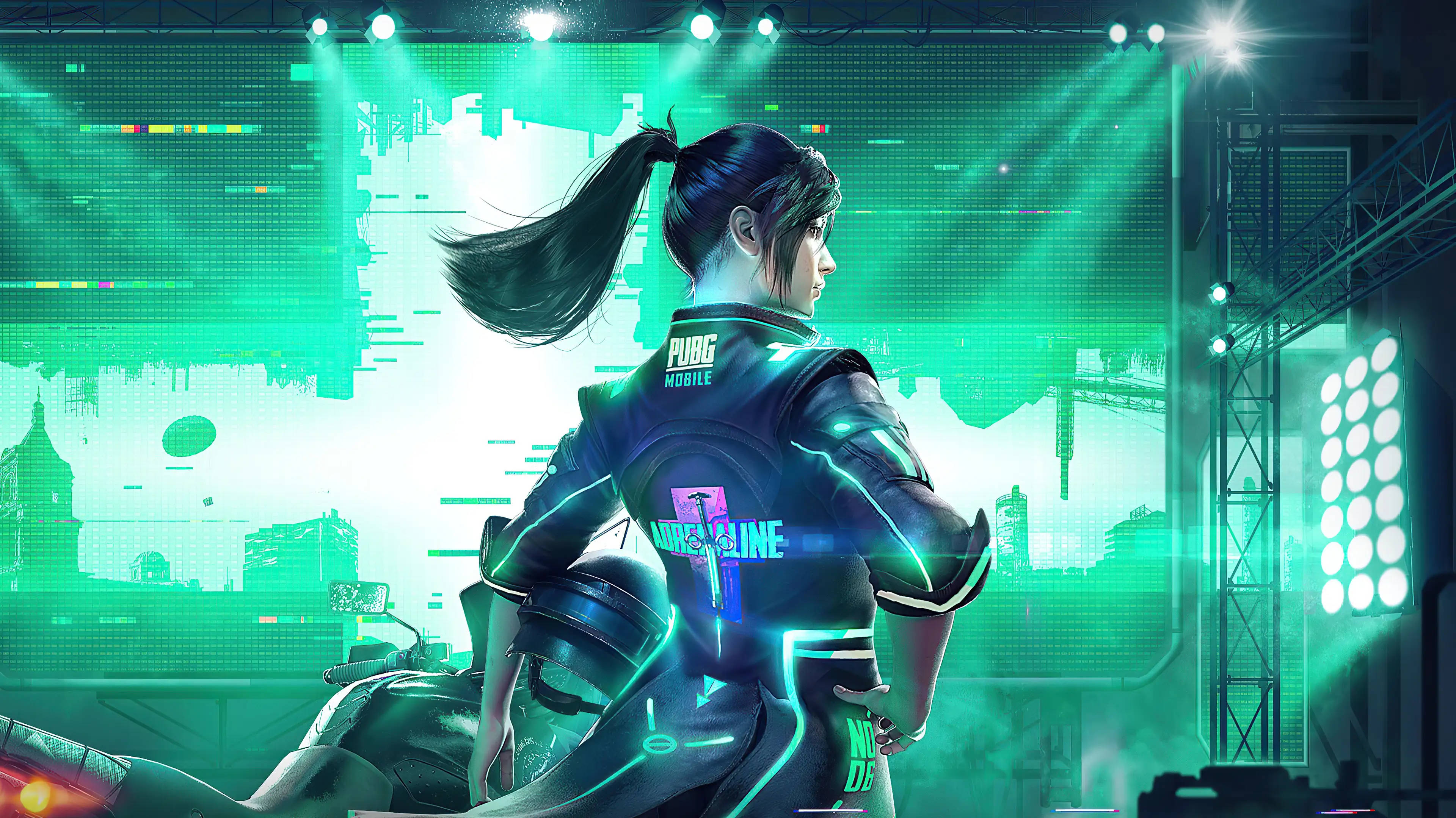 Pc Gaming 桌布 壁紙 — 一名身穿霓虹裝備的賽博龐克玩家站在舞台上，背景是發光的綠色燈光和數位城市景觀。