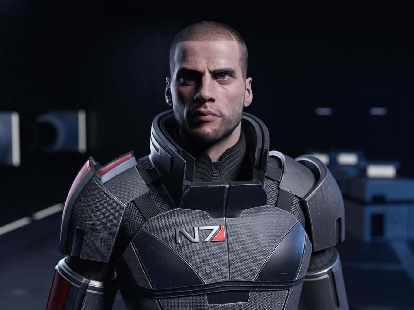 Commander Shepard 桌布 壁紙 — 一名身穿黑色N7裝甲的嚴肅士兵，站在一條昏暗、帶有發光藍色面板的未來風格走廊中。