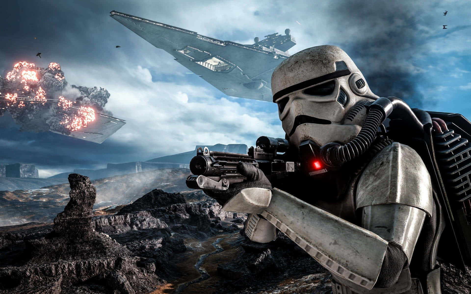 Scarif 桌布 壁紙 — 一名風暴兵在岩石戰場上瞄準爆能槍，星際戰機在陰天天空下於頭頂爆炸。