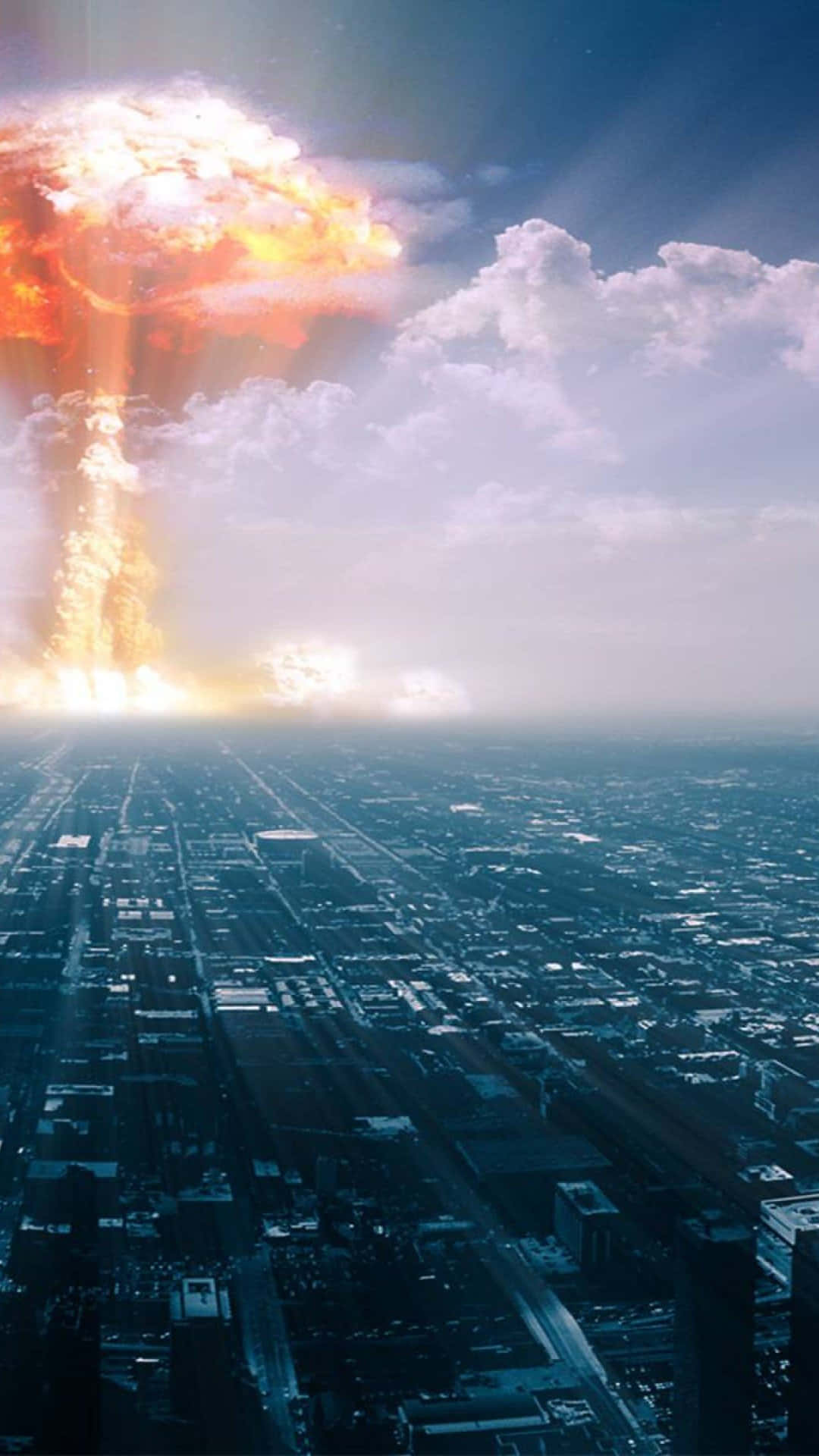 Nuclear Winter 桌布 壁紙 — 一場巨大的核爆炸在戲劇性的天空下，於廣闊的城市景觀上空爆發。