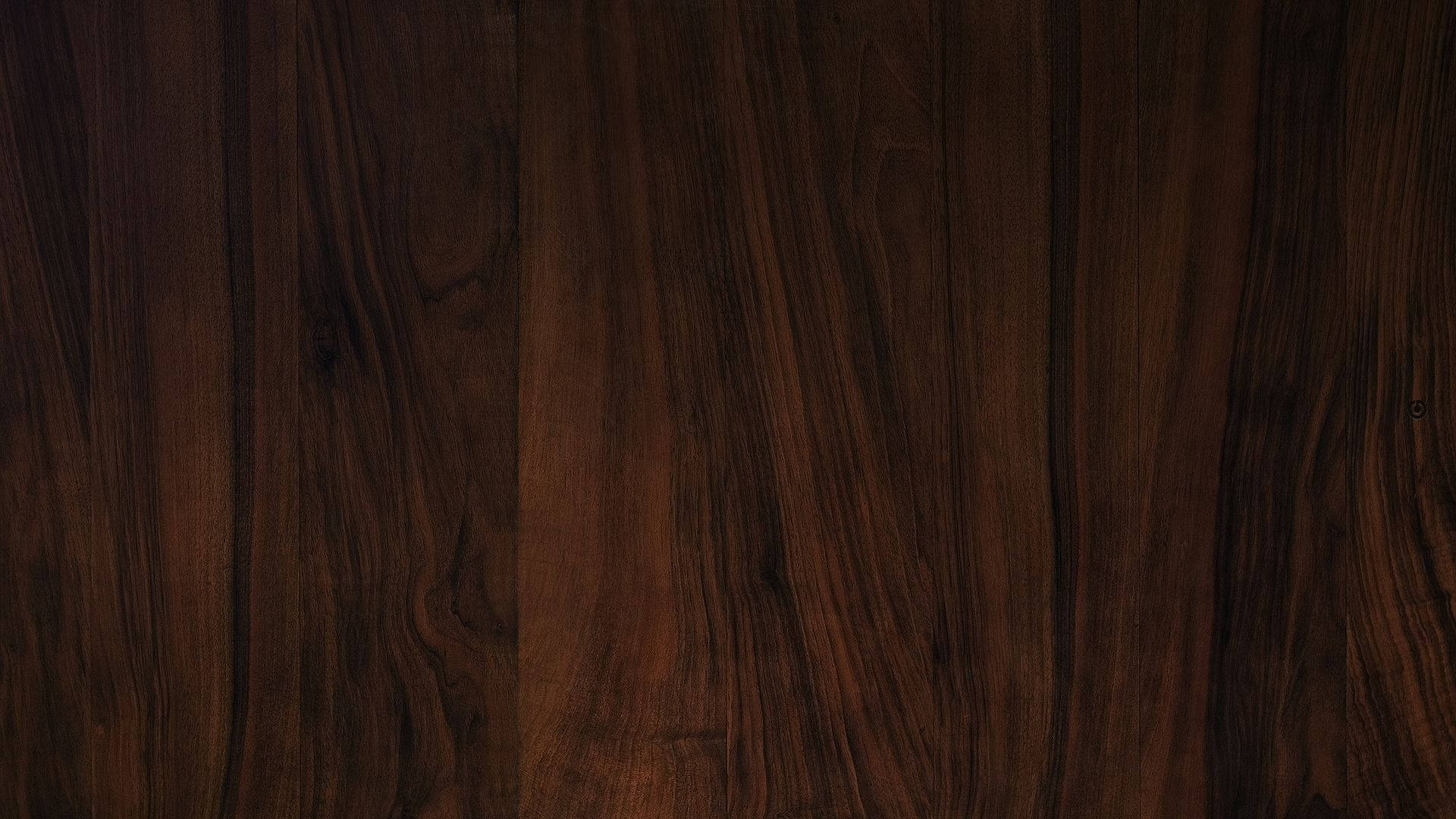 深色木材表面，帶有天然木紋圖案和光滑紋理。