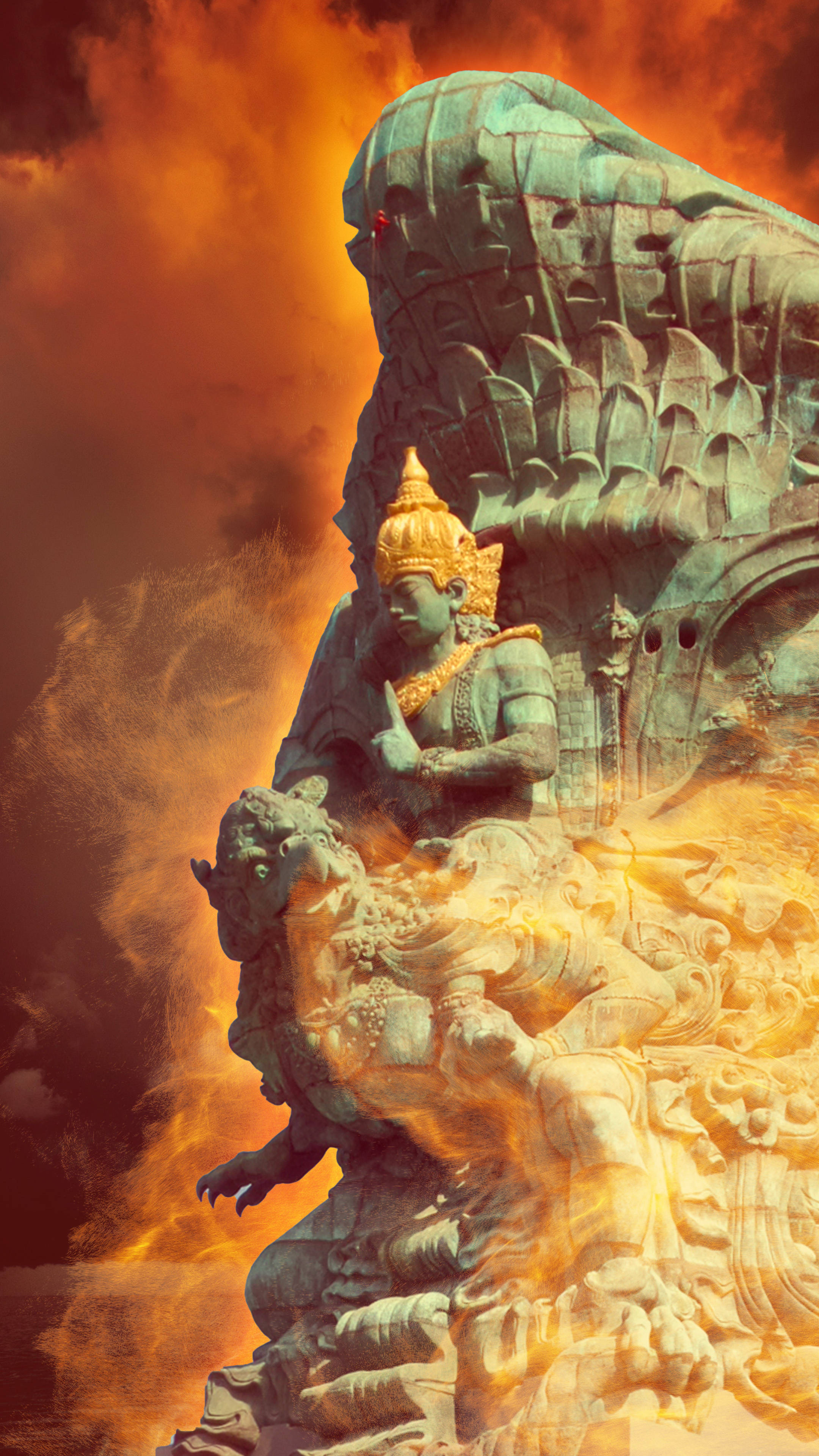Vishnu 桌布 壁紙 — 一尊雄偉的綠銅神像從熾熱的橙色火焰中浮現，背景是戲劇性的天空。