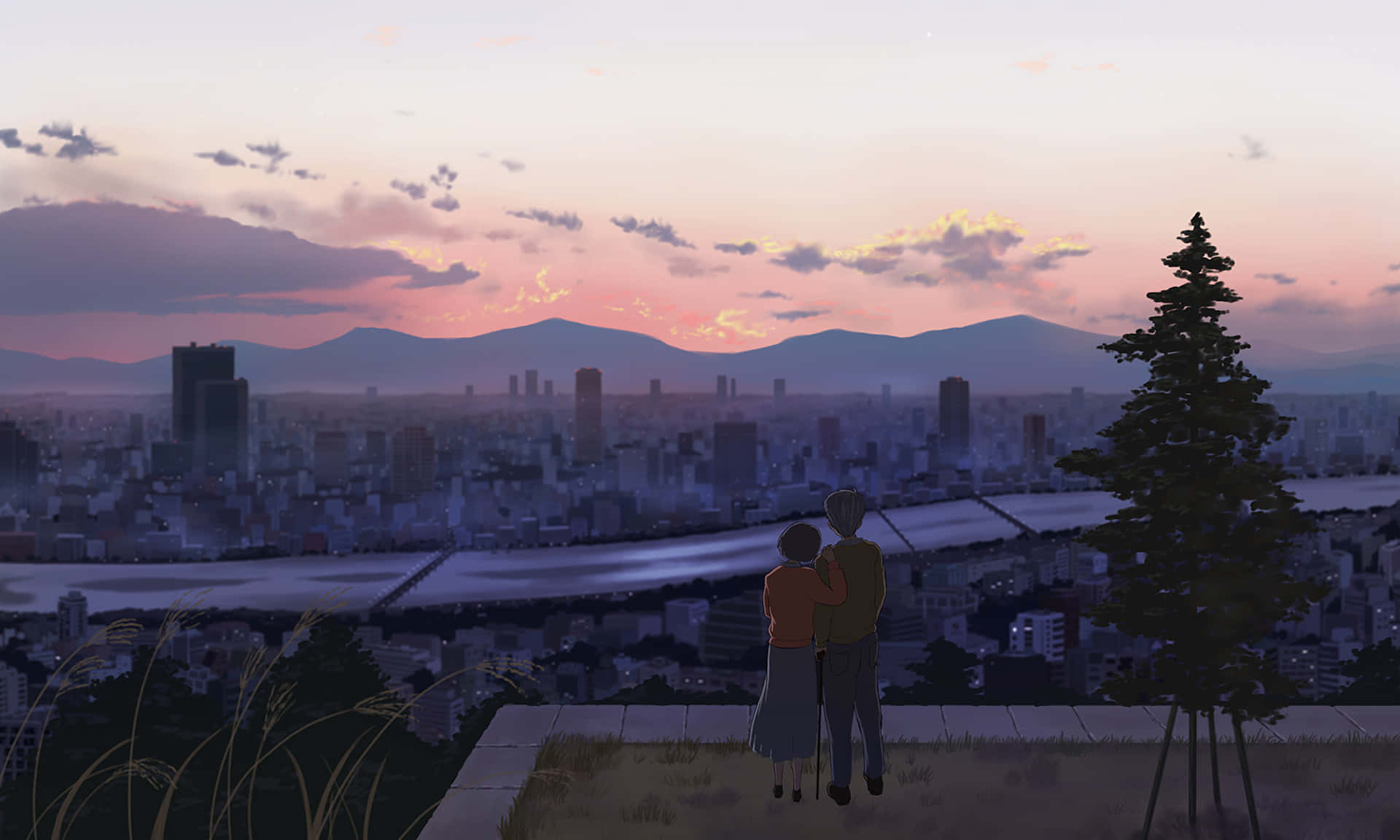 Whisper Of The Heart 桌布 壁紙 — 一對情侶喺山頂上擁抱，俯瞰日落時分嘅廣闊城市，遠方有山脈。