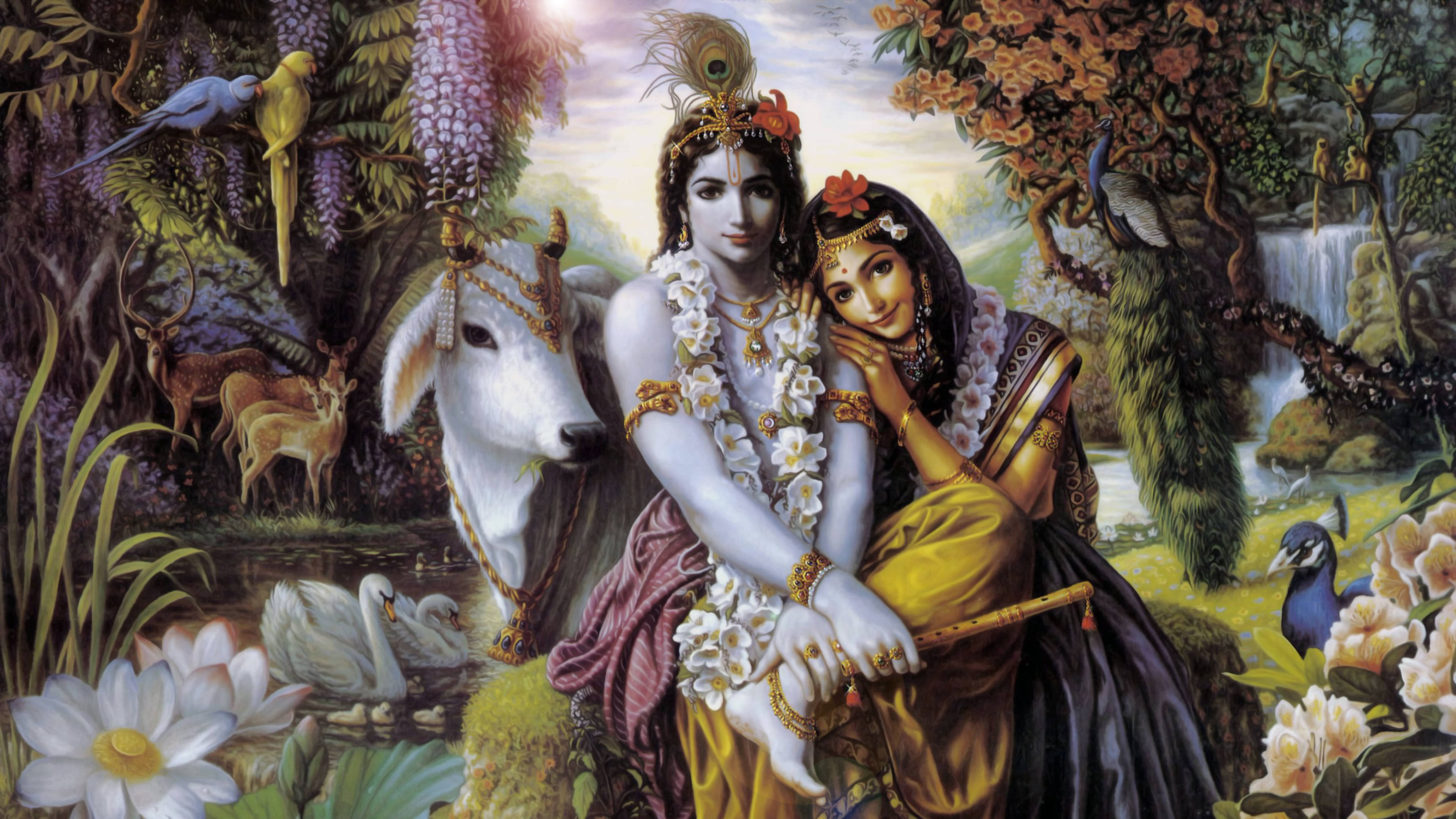 krishna ji 桌布 壁紙 — 一對神聖夫婦身著華麗服飾，坐在茂密的叢林植物中，有一頭白牛和鳥兒，天空柔和發光。