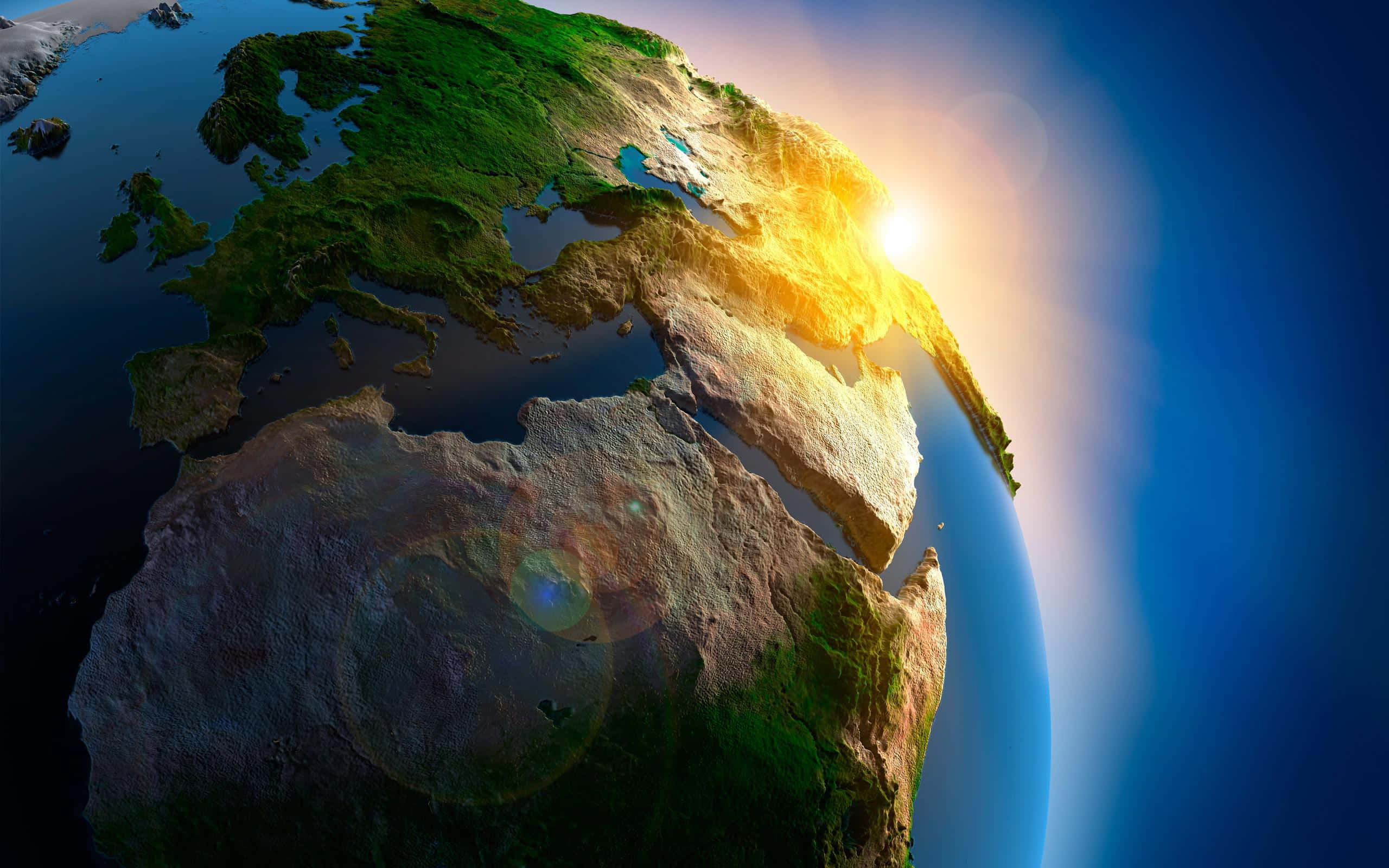 3d Earth 桌布 壁紙 — 一幅令人驚嘆的3D渲染地球日出景象，金色光芒照亮歐洲、非洲和亞洲，背景是深藍色的太空。