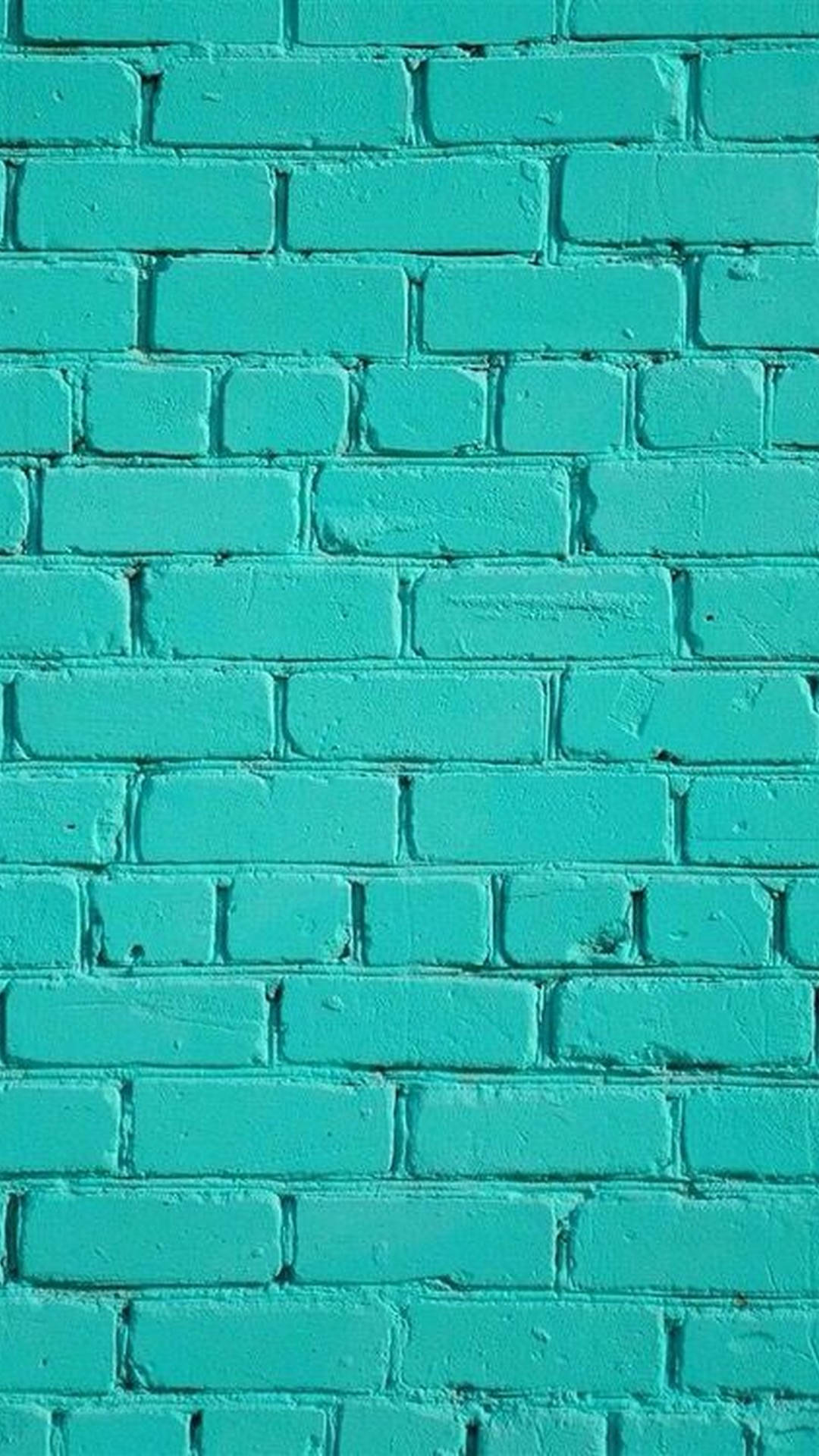 Brick Wall 桌布 壁紙 — 一幅磚牆的特寫，牆身髹上鮮豔的藍綠色，可見紋理和灰泥線。