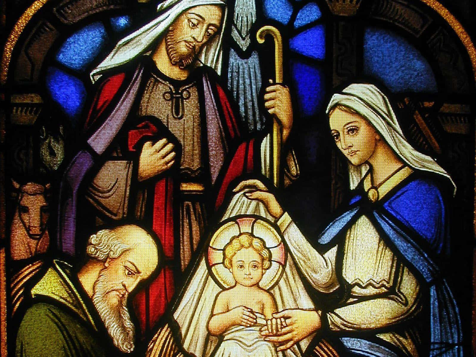 Nativity 桌布 壁紙 — 一幅色彩鮮豔的彩繪玻璃窗描繪了聖家（瑪利亞、若瑟和嬰孩耶穌）被光芒環繞。