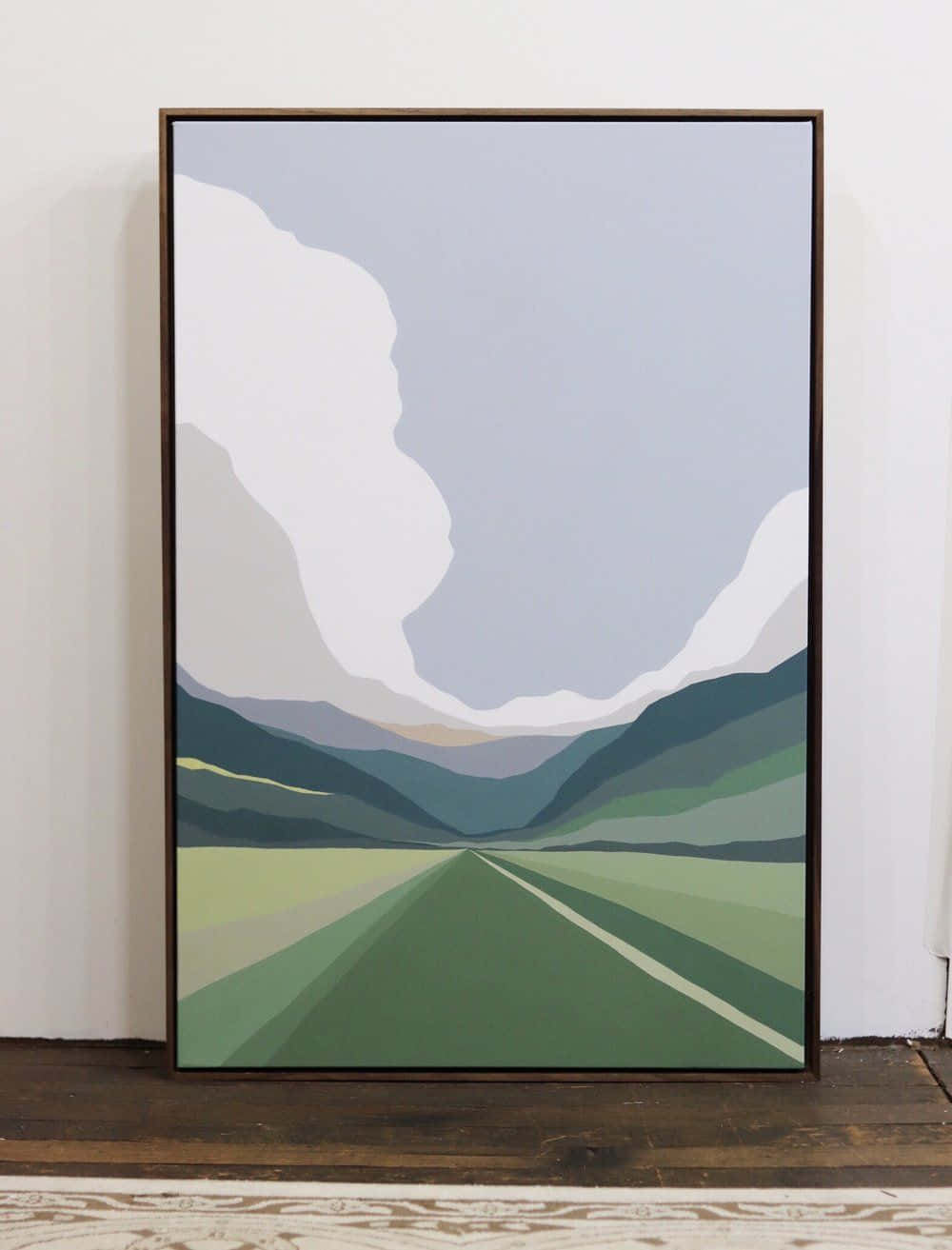 Modern Minimalist Art 桌布 壁紙 — 一幅裱框的極簡插圖展示了一條道路在柔和的灰色雲層下延伸向層疊的綠色山丘。