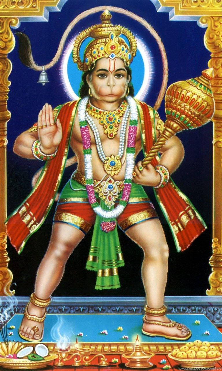 Hanuman 桌布 壁紙 — 一幅雄偉的插圖，描繪印度教神祇哈努曼，飾有鮮豔的紅、綠、金色珠寶，手持狼牙棒，身後有光輝的光環。