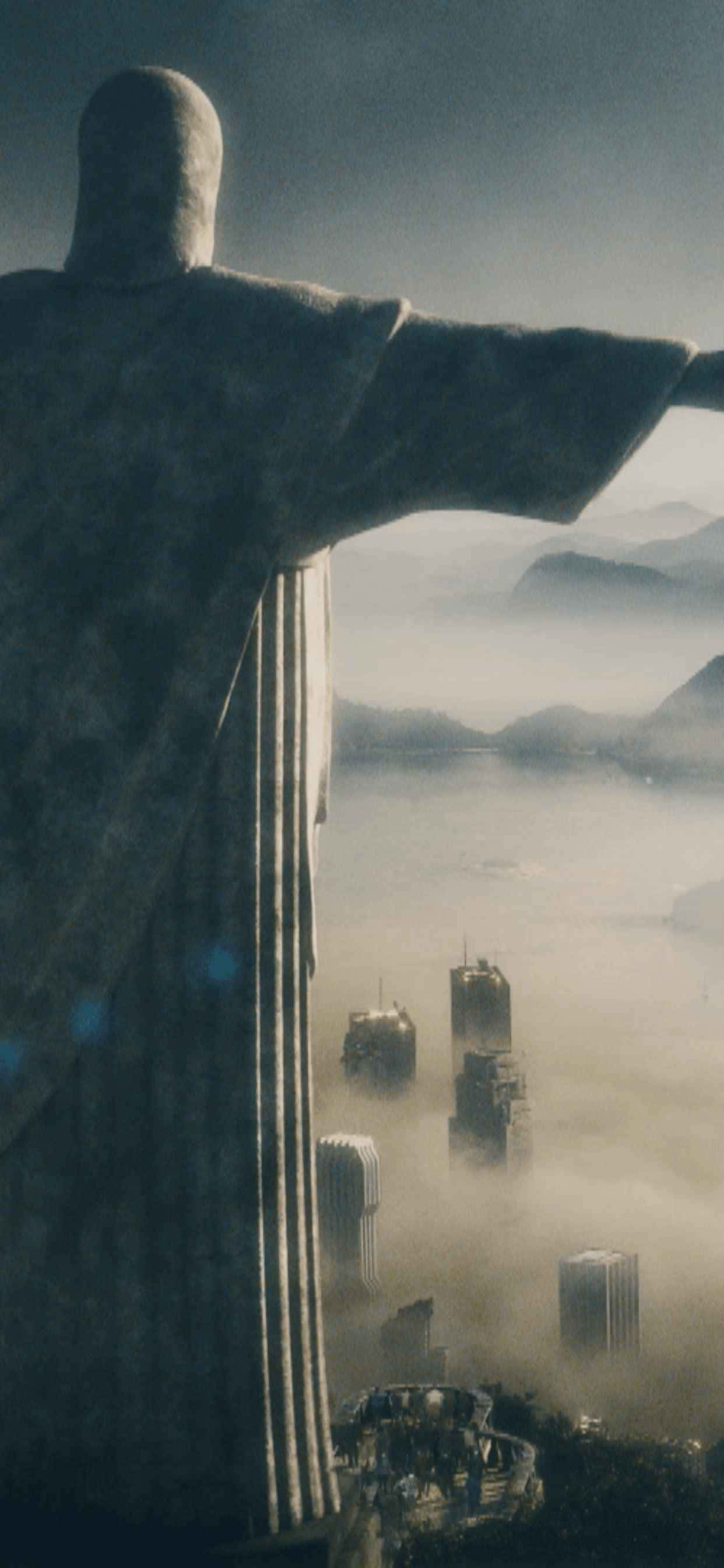 一座基督雕像，背景是城市 壁紙