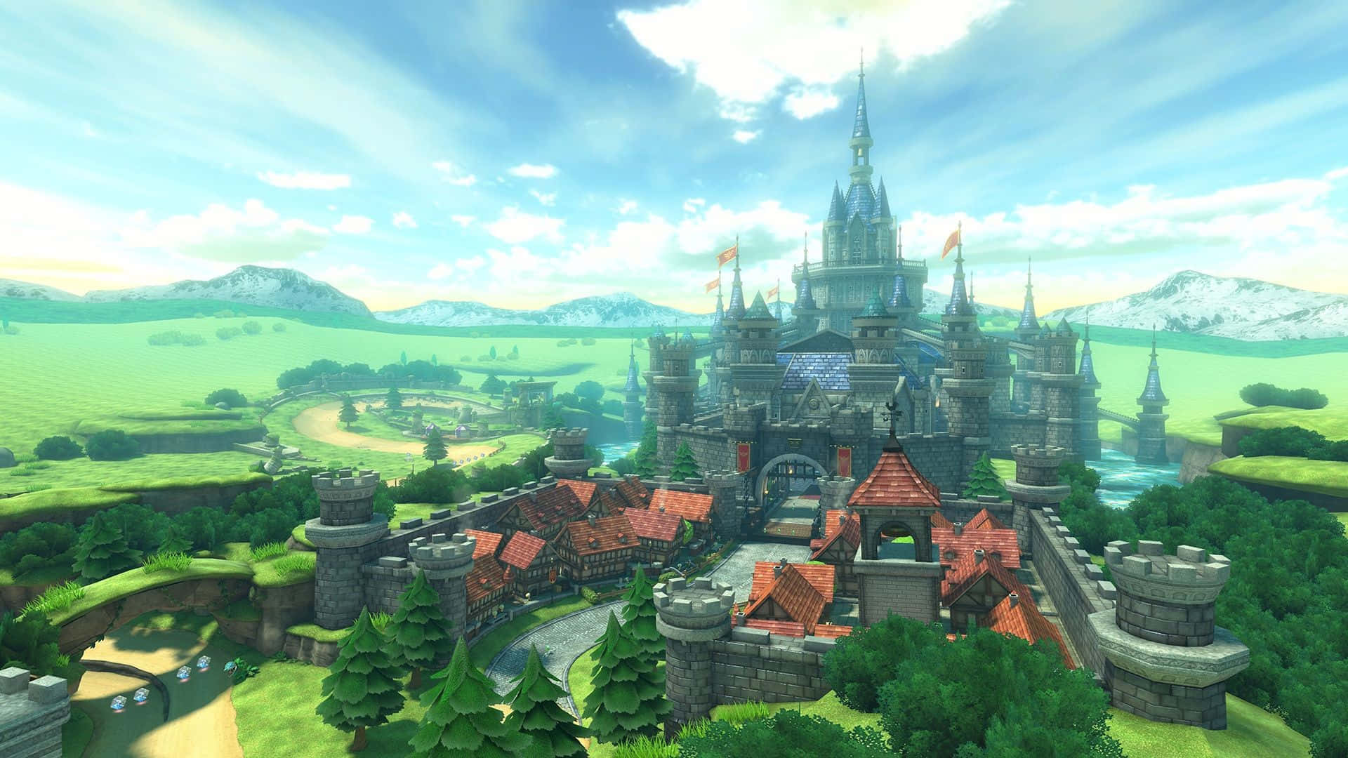 The Legend Of Zelda Hyrule 桌布 壁紙 — 一座宏偉的奇幻城堡，擁有紅色屋頂和石塔，矗立在山丘上，周圍是鬱鬱蔥蔥的綠色田野和遠處白雪覆蓋的山脈，在明亮的藍天下。