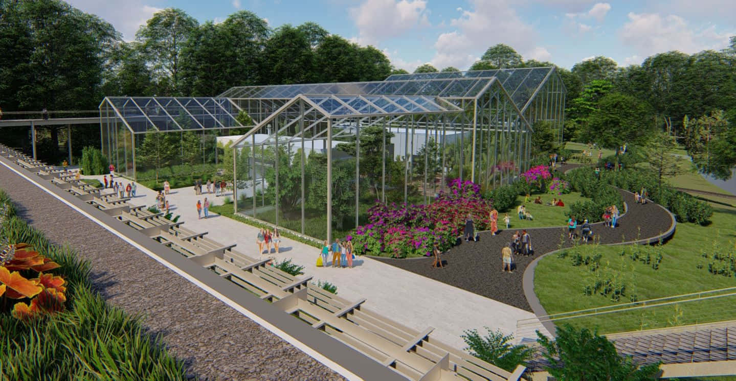 Botanical Garden 桌布 壁紙 — 一座現代玻璃溫室，配備太陽能板，坐落於茂盛花園中，園內有蜿蜒小徑和色彩繽紛的花壇，上方是明亮的藍天。