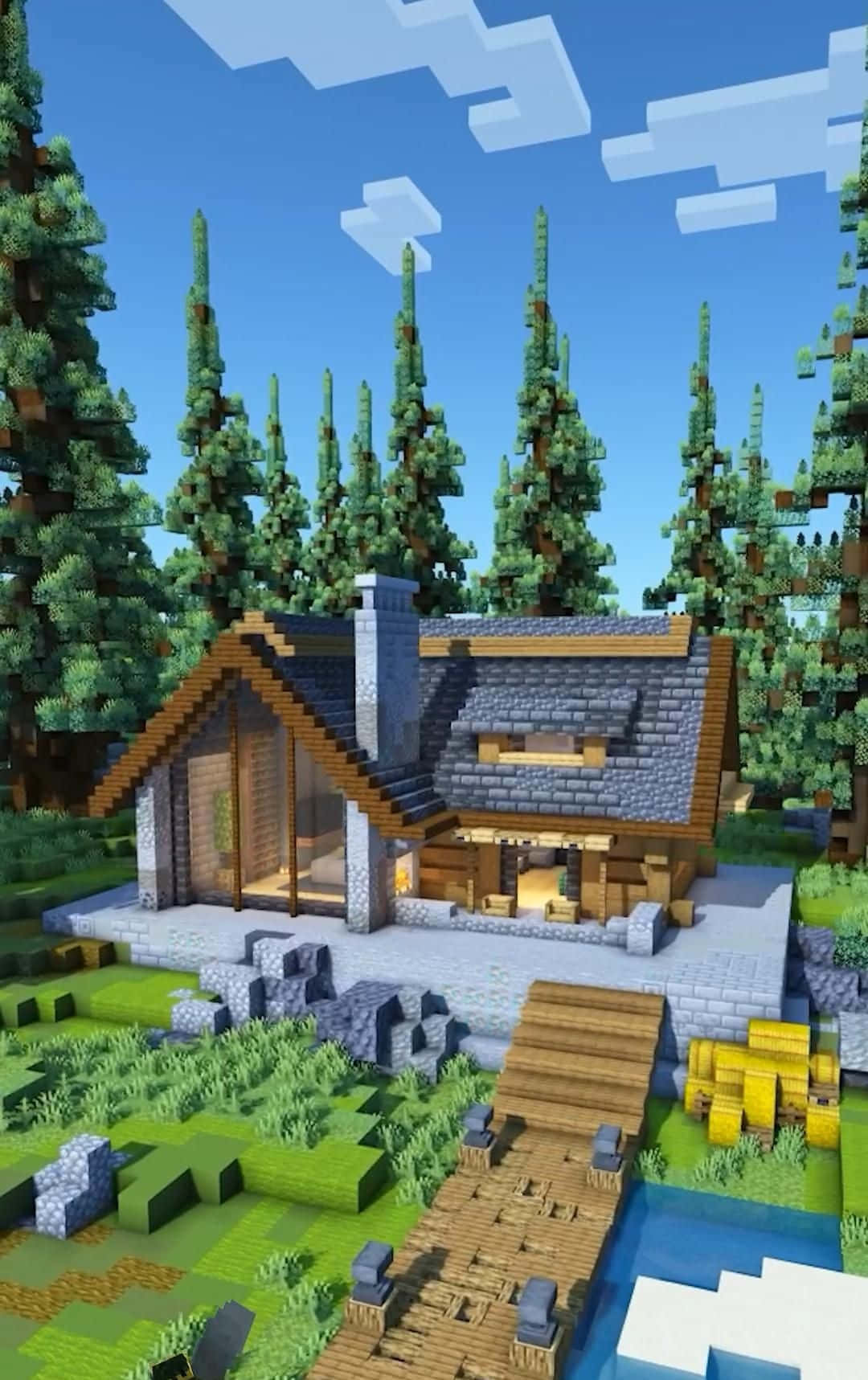 Minecraft Architecture 桌布 壁紙 — 一座舒適的像素風小屋隱藏在森林中，小溪上有一座木橋，上方是明亮的藍天。