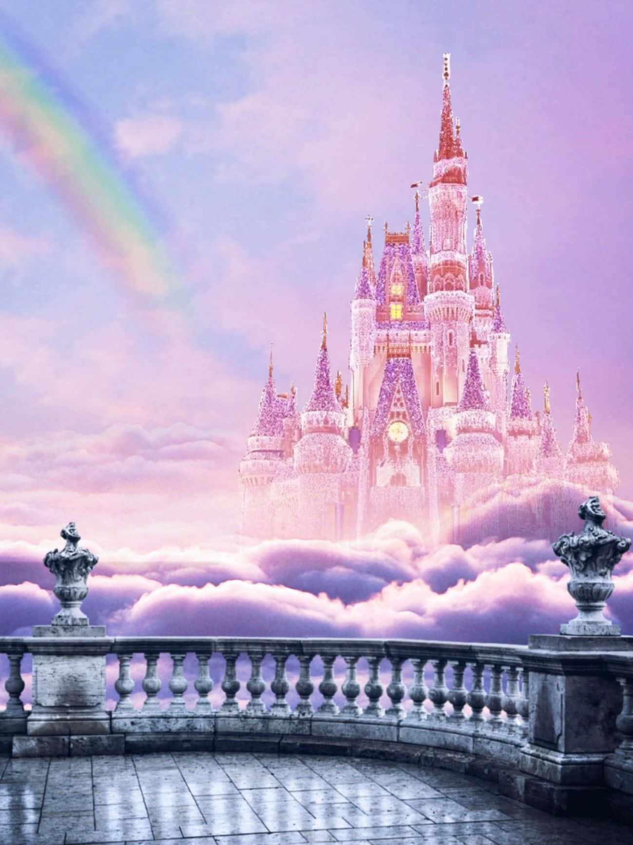 Disney Castle 桌布 壁紙 — 一座雄偉的城堡，閃爍的尖塔聳立在粉紅色的雲層之上，彩虹橫跨粉彩色的天空。