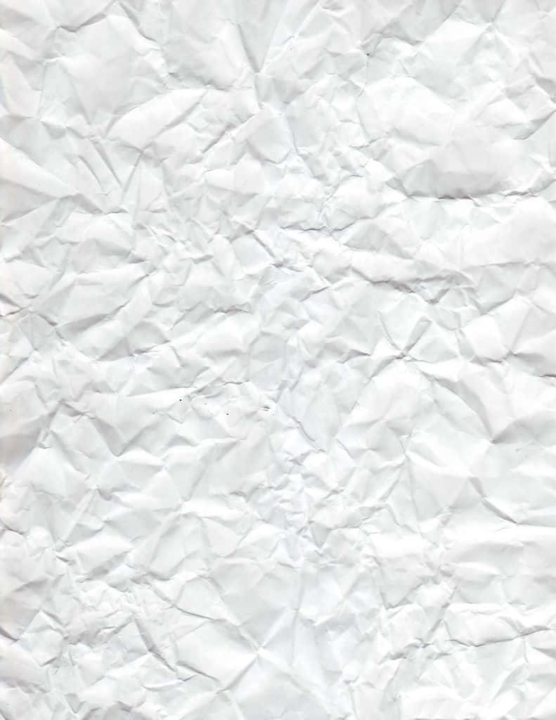 White Noise 桌布 壁紙 — 一張嚴重皺摺的白紙特寫，帶有深摺痕和柔和陰影，營造出觸感紋理表面。