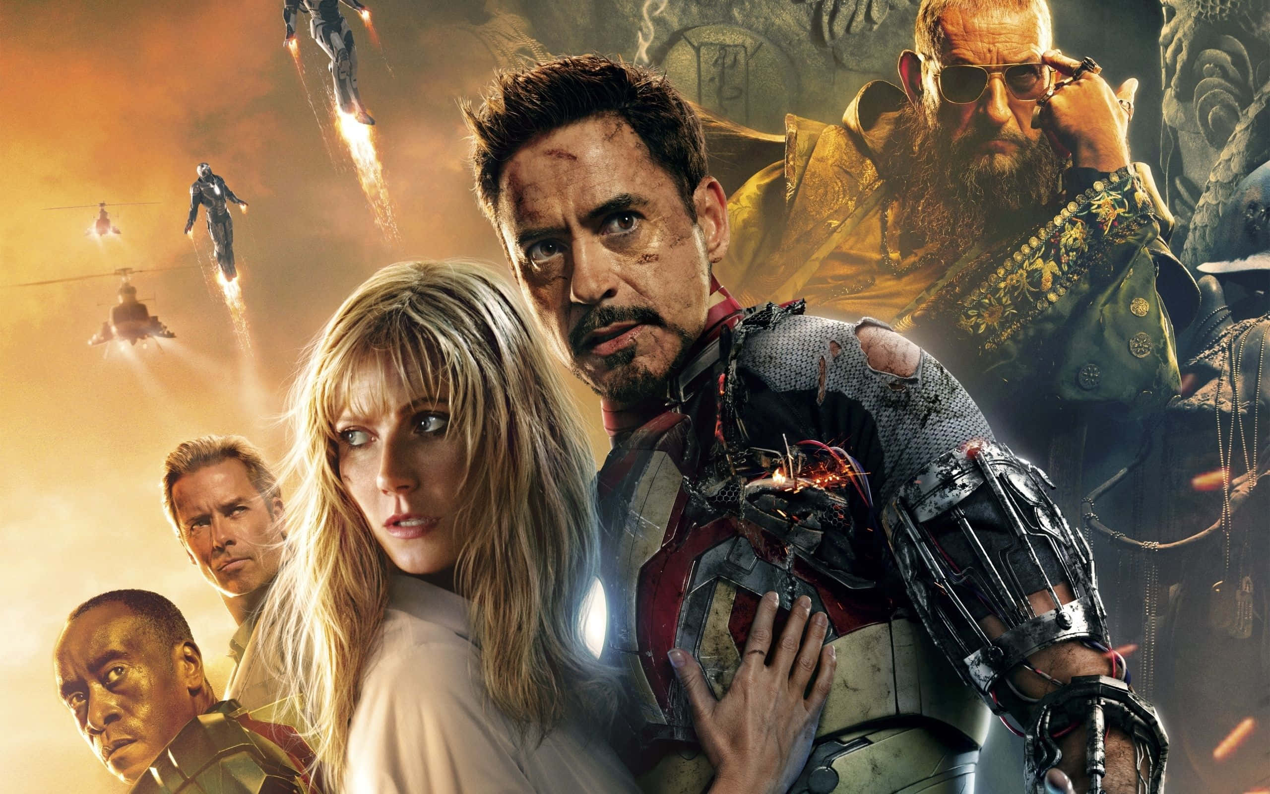 Iron Man Movies 桌布 壁紙 — 一張戲劇性的超級英雄電影海報，以鋼鐵人穿著受損的裝甲為主角，周圍是關鍵角色，背景是熾熱的戰場。