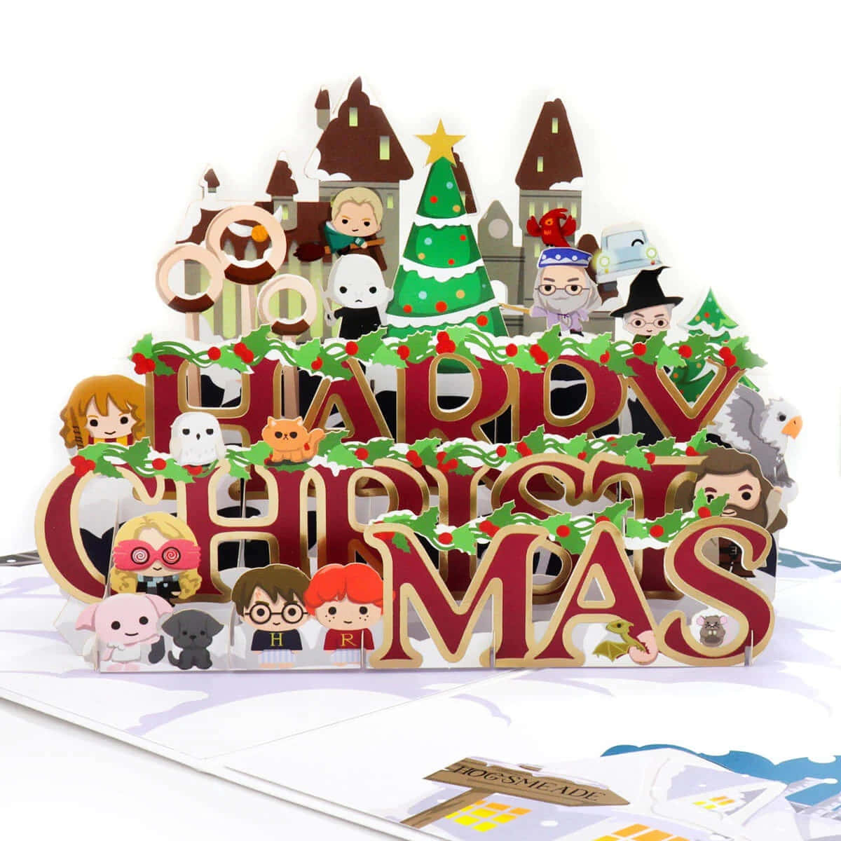 Harry Potter Christmas 桌布 壁紙 — 一張節日3D立體聖誕卡， featuring 哈利波特角色和霍格華茲建築，裝飾著冬青和一棵樹。
