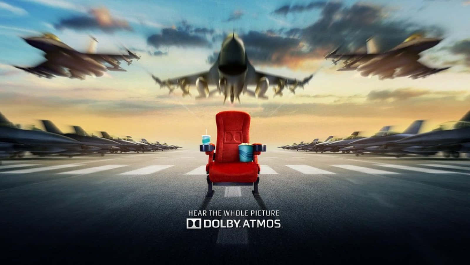 Dolby Digital 桌布 壁紙 — 一張紅色戲院座椅位於機場停機坪中央，戰鬥機在夕陽天空下呼嘯而過。
