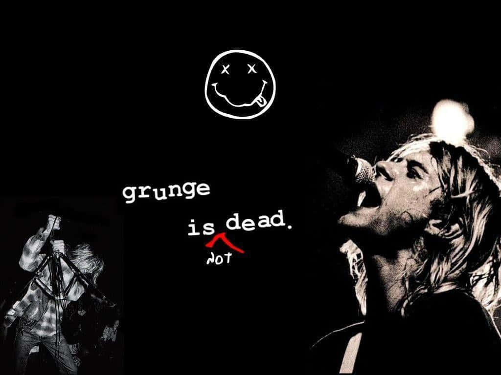 涅槃 桌布 壁紙 — 一張黑白照片，Kurt Cobain 對著麥克風唱歌，帶有標誌性的Nirvana笑臉和文字grunge is dead not。