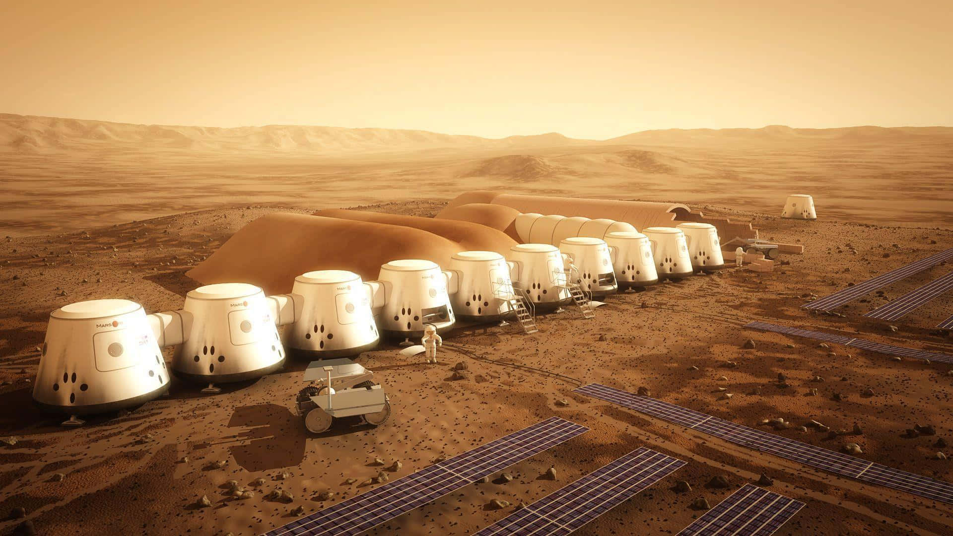 The Martian 桌布 壁紙 — 一排白色圓頂棲息地和太陽能電池板點綴在火星銹紅色的平原上，天空是朦朧的橙色。
