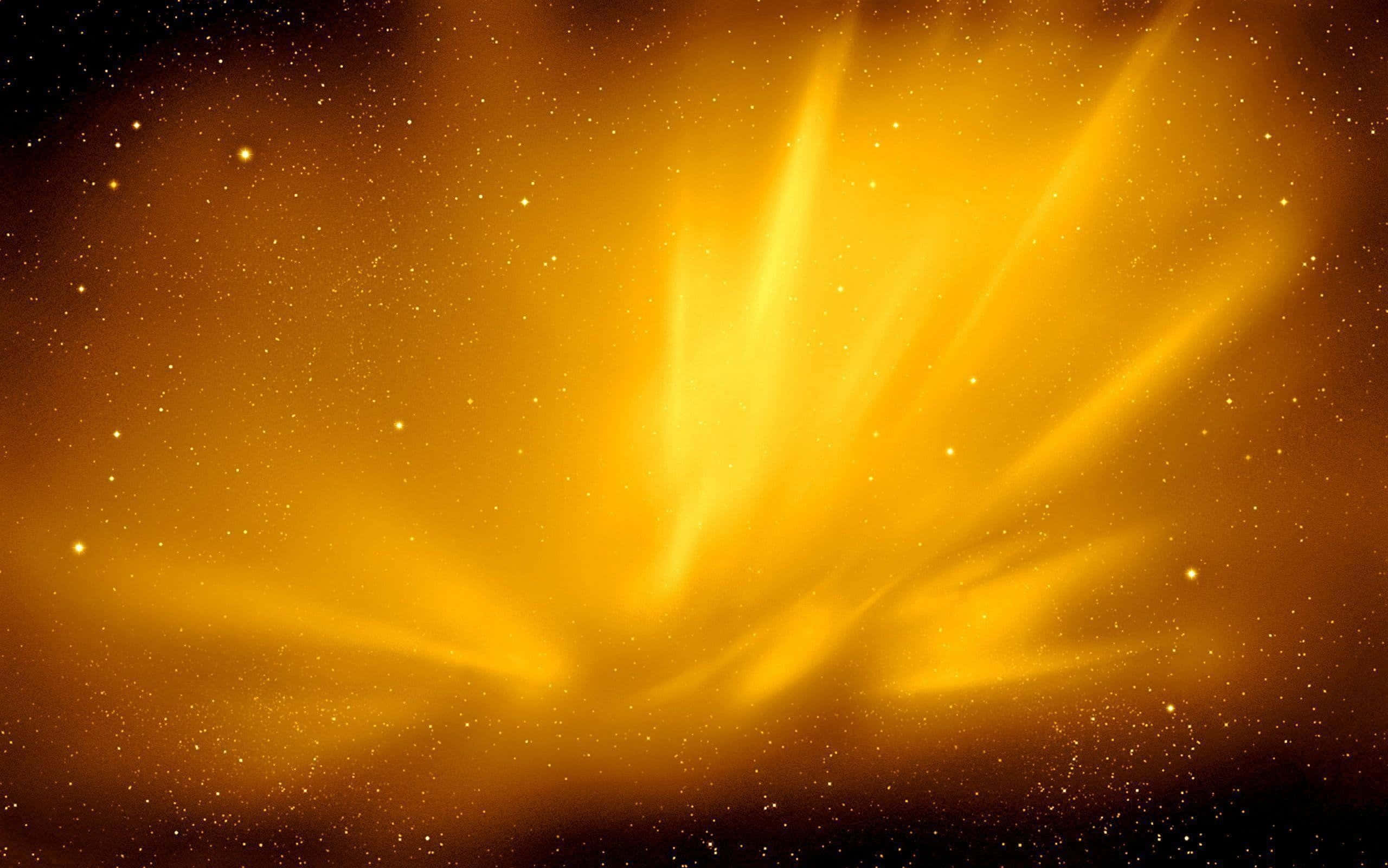 Yellow Galaxy 桌布 壁紙 — 一束燦爛的金色光芒在繁星點點的宇宙背景下爆發，散發出柔和的光線。