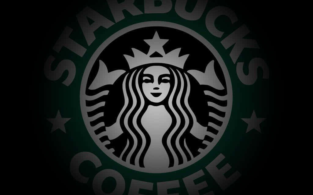 Starbucks咖啡標誌，深綠色圓圈內有女妖，黑色背景。