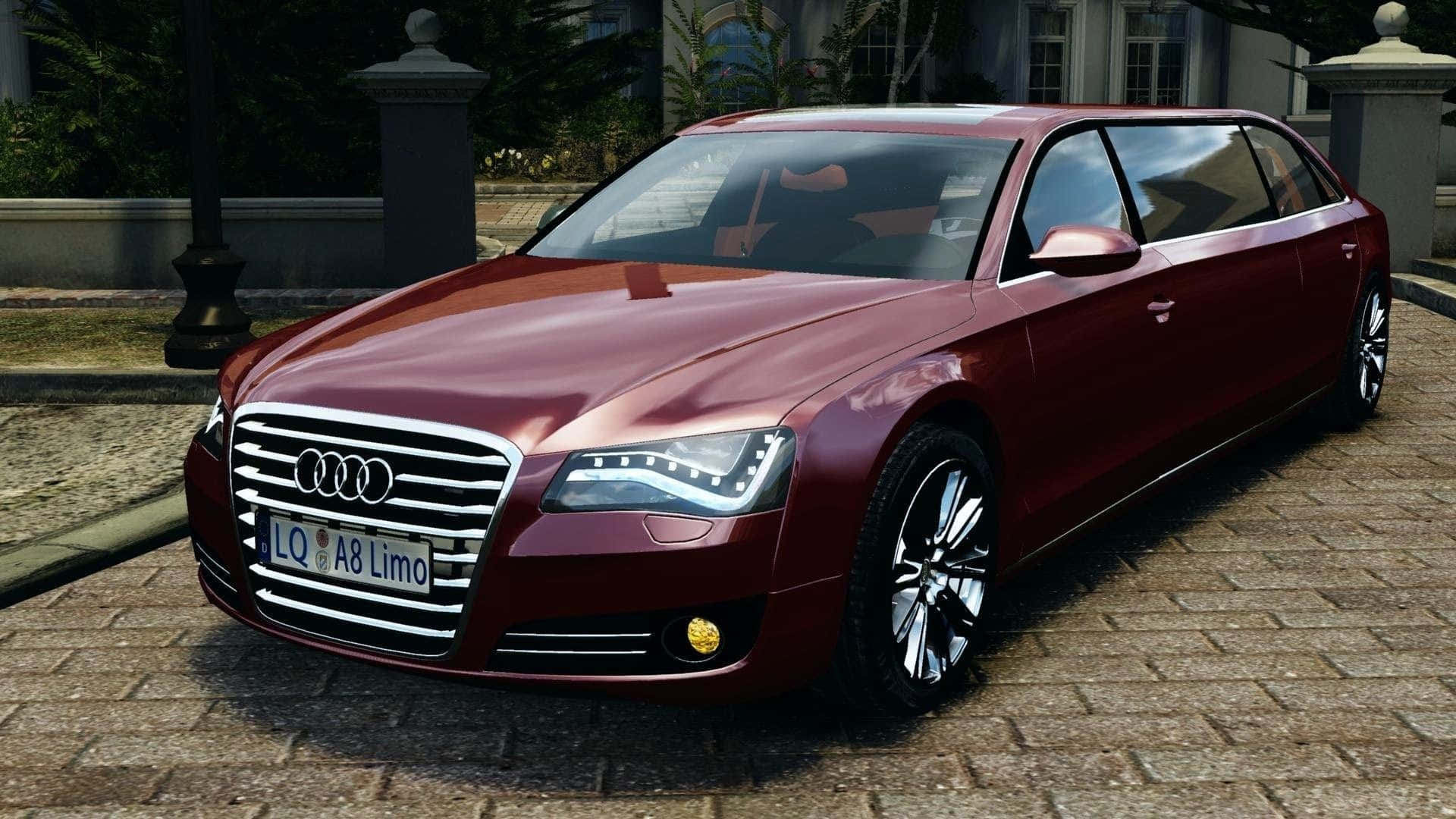 Audi S8 桌布 壁紙 — 一架亮面棗紅色Audi A8豪華轎車停泊在鵝卵石車道上，旁邊是一座宏偉的大宅。