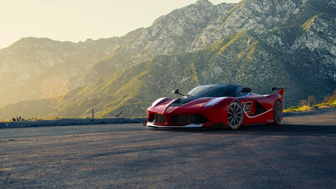Sports Car 桌布 壁紙 — 一架搶眼的紅色法拉利SF90 Stradale停泊在山路上，崎嶇的山峰沐浴在金色的日落光芒中。