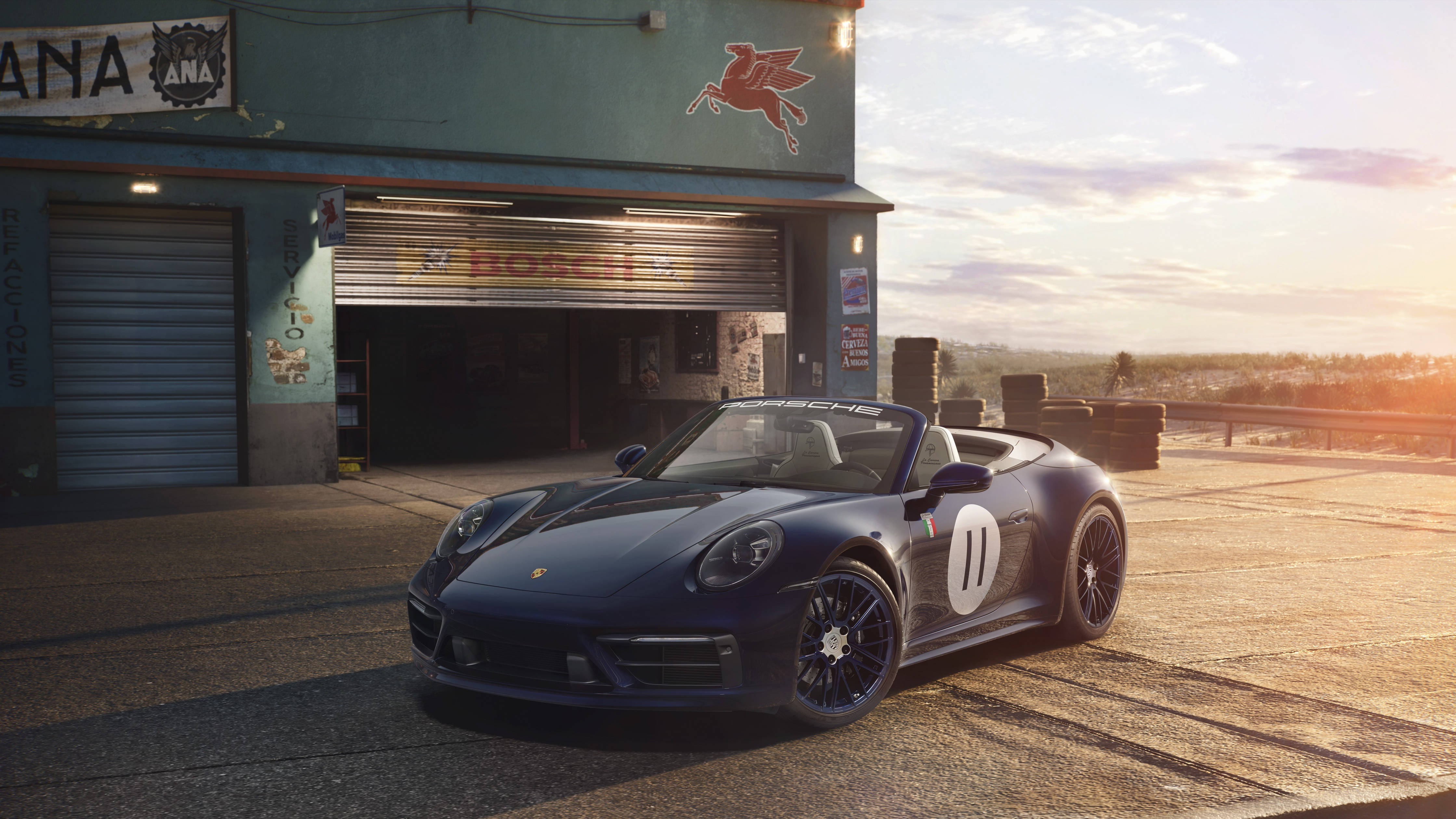保時捷 桌布 壁紙 — 一架時尚深藍色保時捷911 Speedster，帶有賽車號碼11，在黃金時刻停放在復古車庫前。