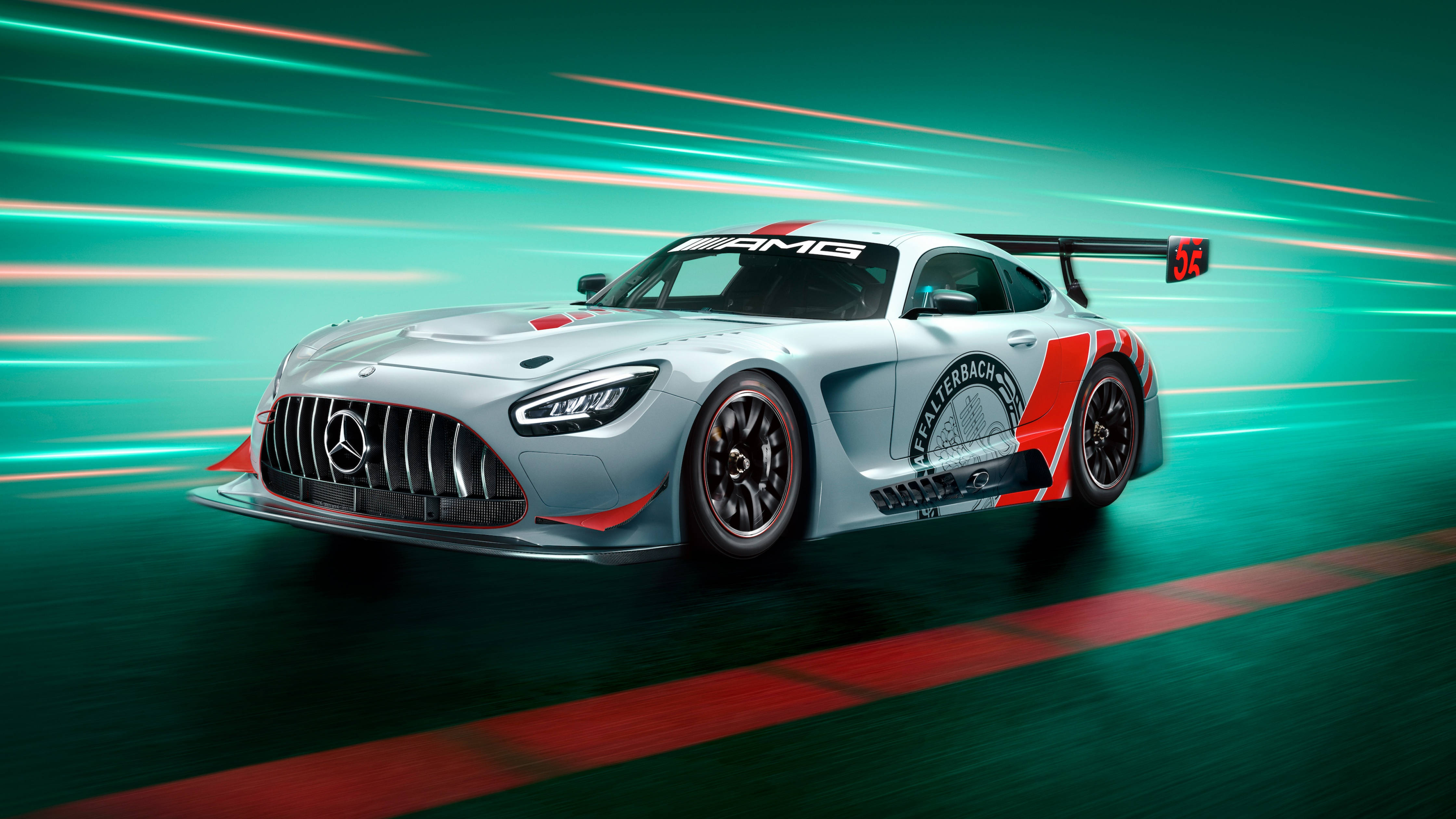 Mercedes 桌布 壁紙 — 一架銀色 Mercedes-AMG GT3 賽車在賽道上疾馳，帶有青綠色的動態模糊條紋和紅色賽道線。