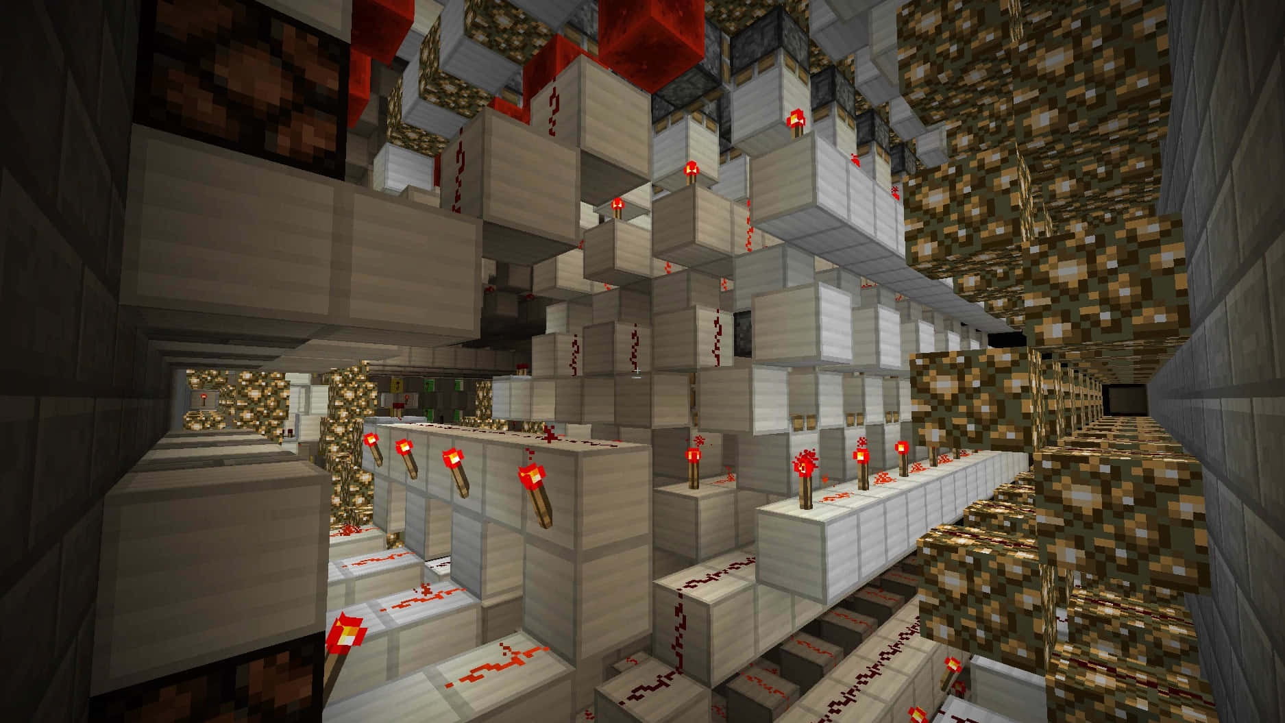 Minecraft Redstone 桌布 壁紙 — 一條Minecraft礦井通道，沿石頭走廊排列著木製儲物箱和紅石火炬。