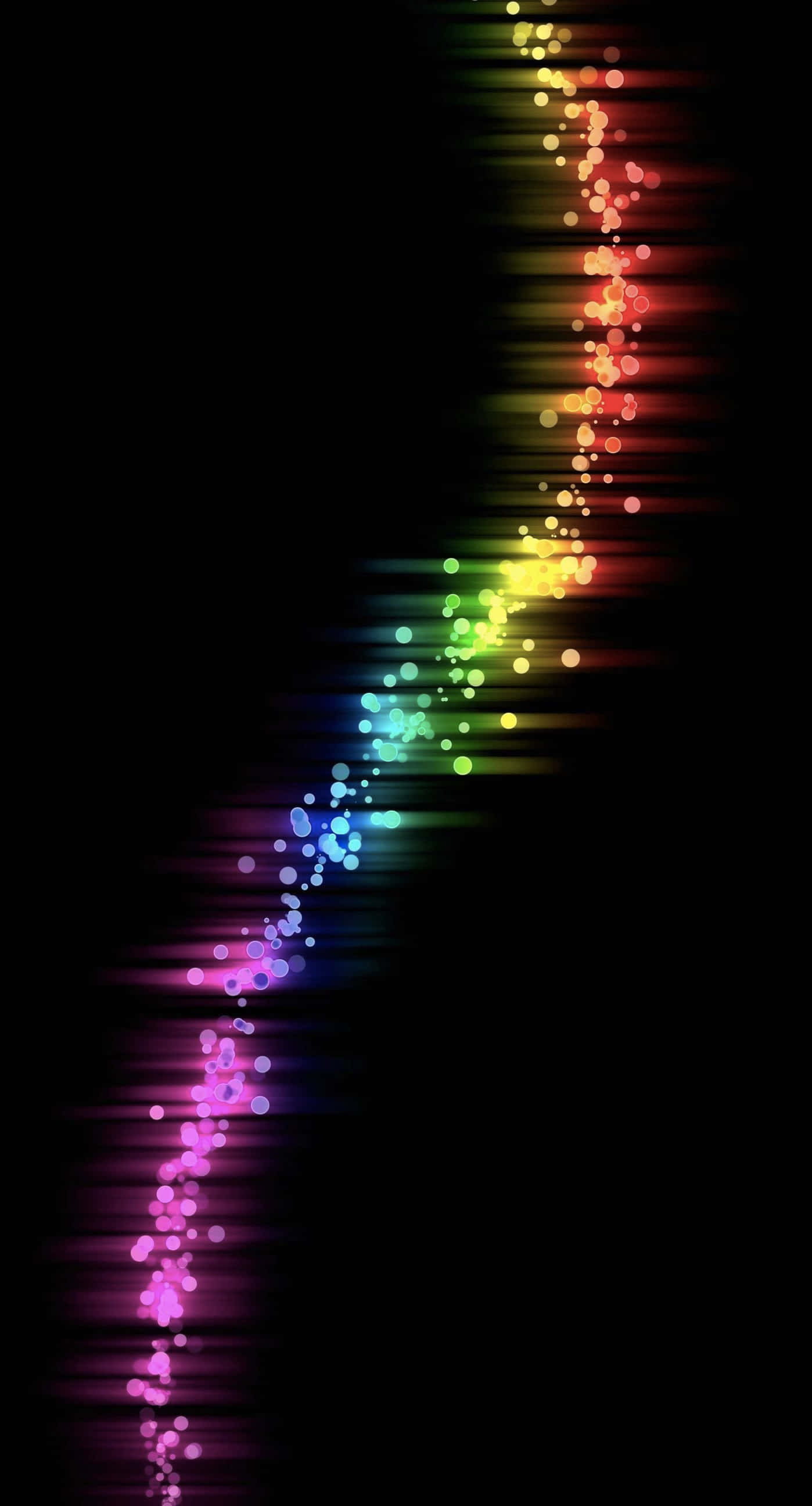 Color Phone 桌布 壁紙 — 一條充滿活力的彩虹軌跡，由發光球體組成，斜向劃過黑色虛空，散發出繽紛光芒。