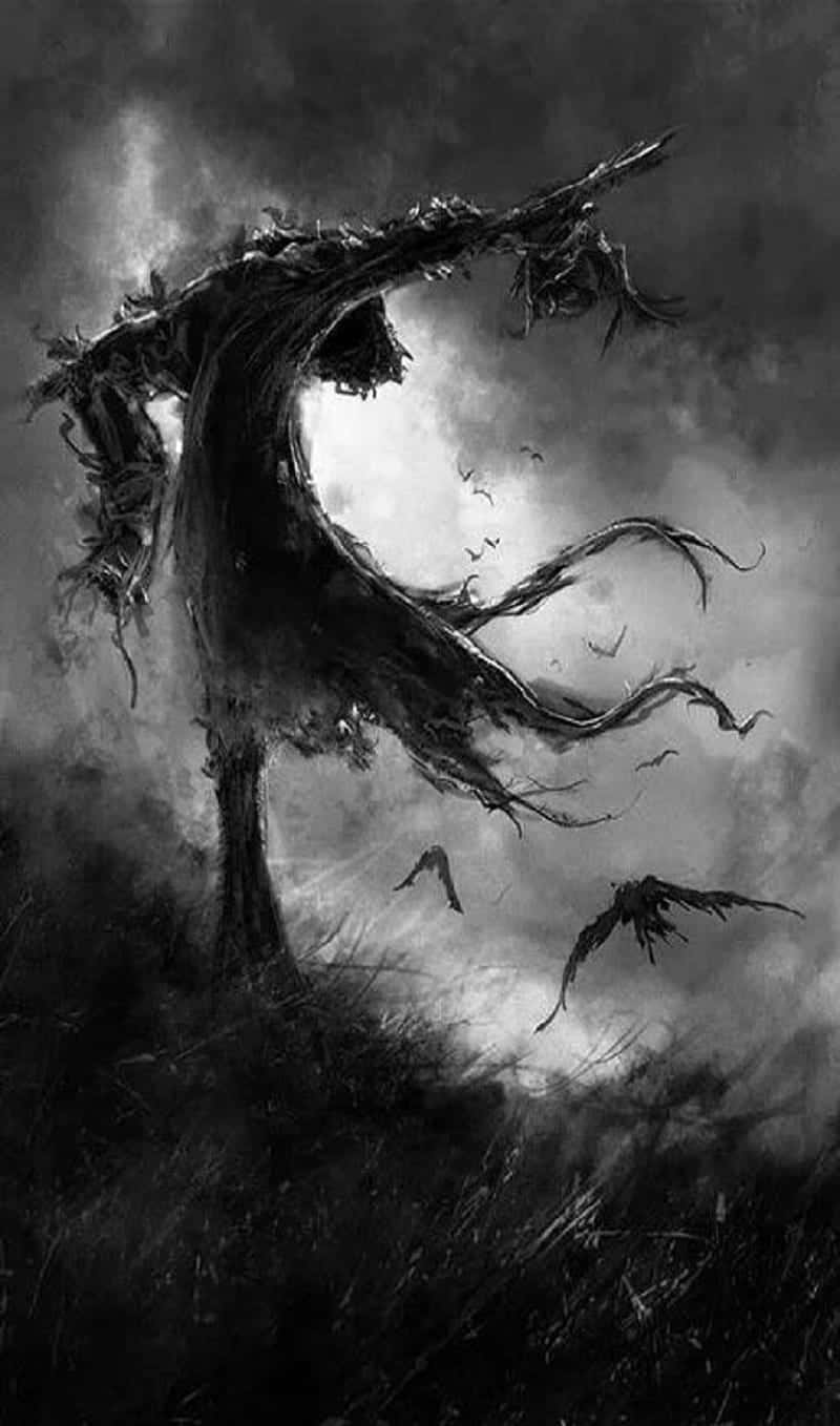 Scarecrows 桌布 壁紙 — 一棵扭曲多節的樹，伸展的樹枝在暴風雨的天空下形成剪影，鳥兒在周圍飛翔。