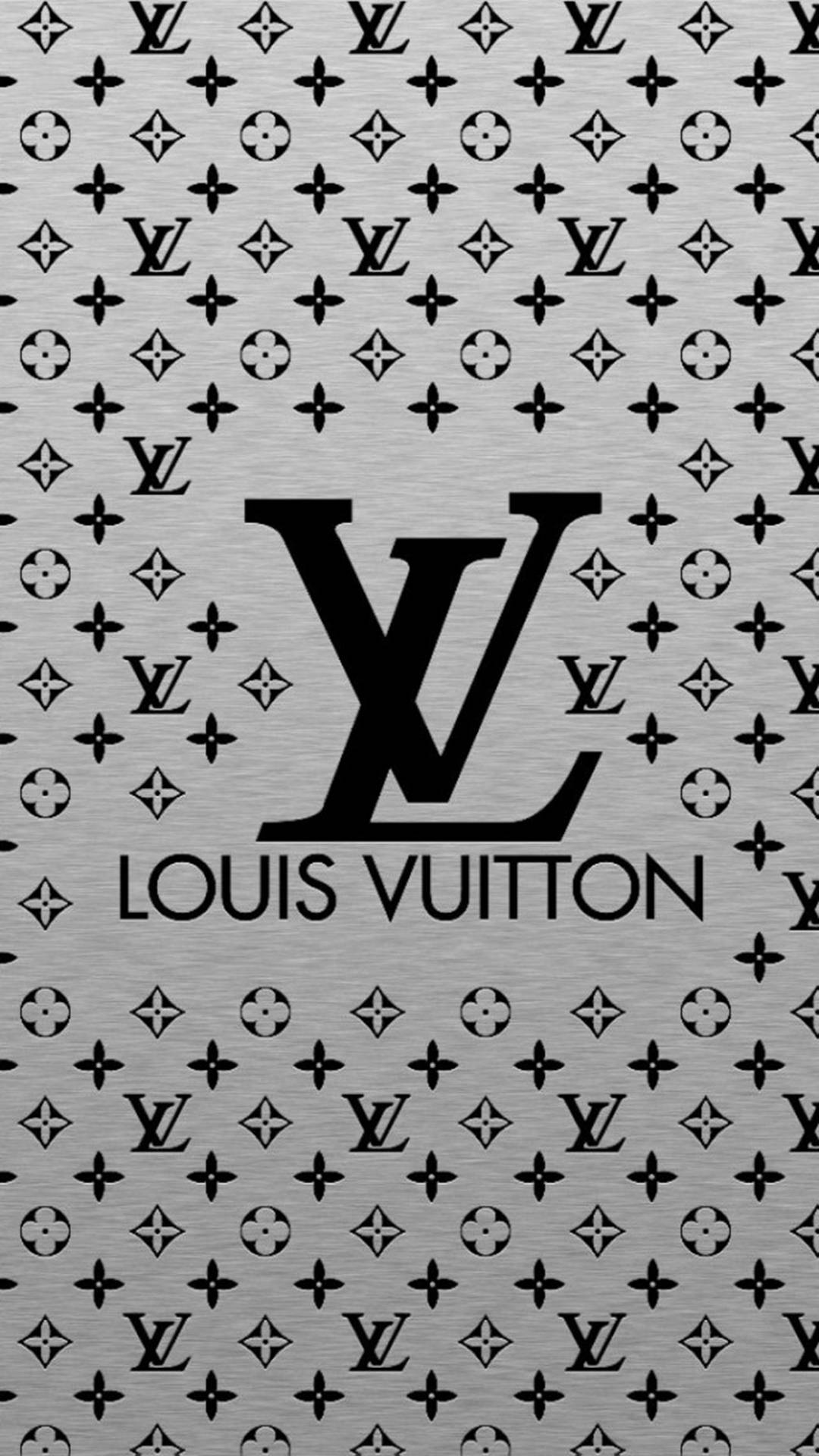 路易威登 桌布 壁紙 — 一款單色牆紙，採用重複的 Louis Vuitton 字母組合圖案，中央有一個大型標誌，背景為拉絲金屬質感。