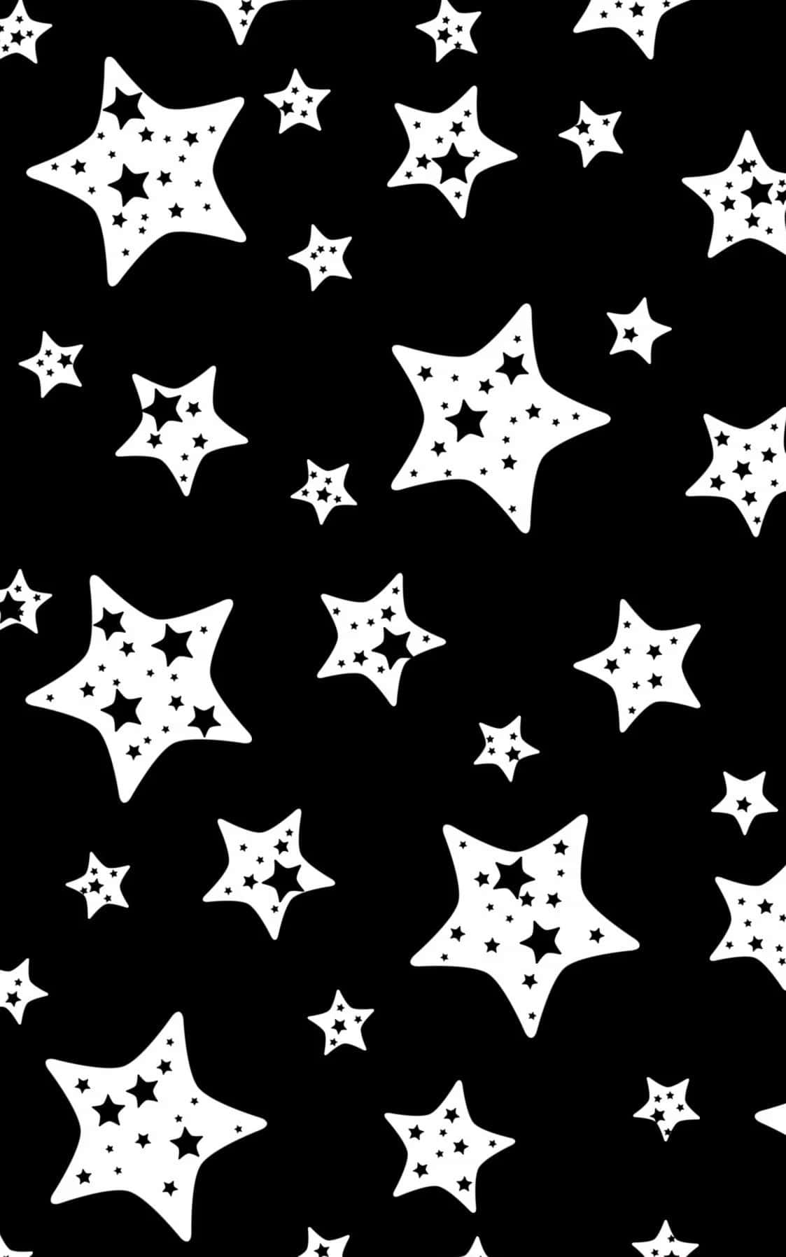 Black And White Star 桌布 壁紙 — 一款大膽的黑白牆紙，散佈著不同大小的星星，內部帶有星星圖案。