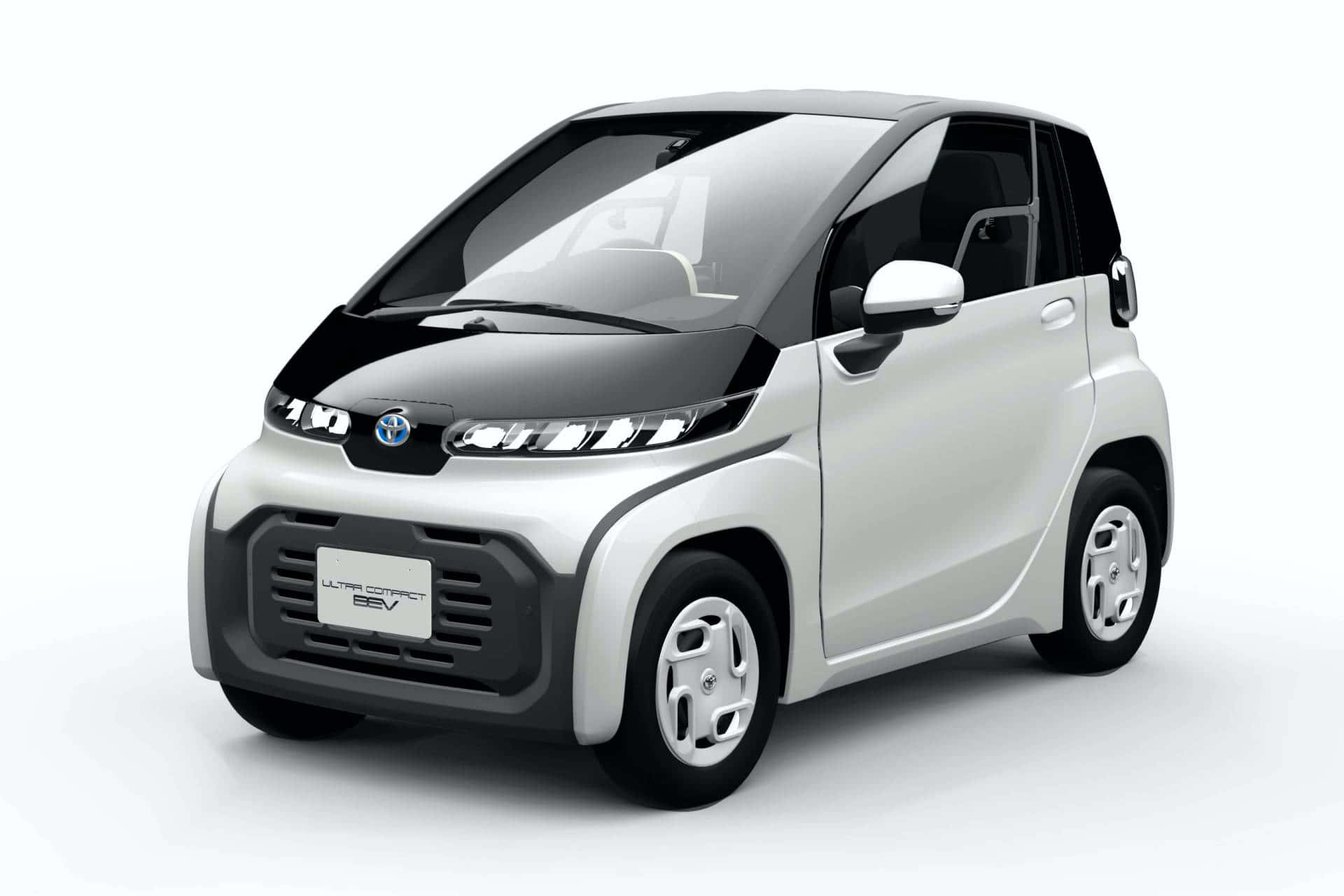 Compact Car 桌布 壁紙 — 一款時尚的白色和黑色緊湊型電動車，採用現代設計和極簡線條，在工作室燈光下展示。